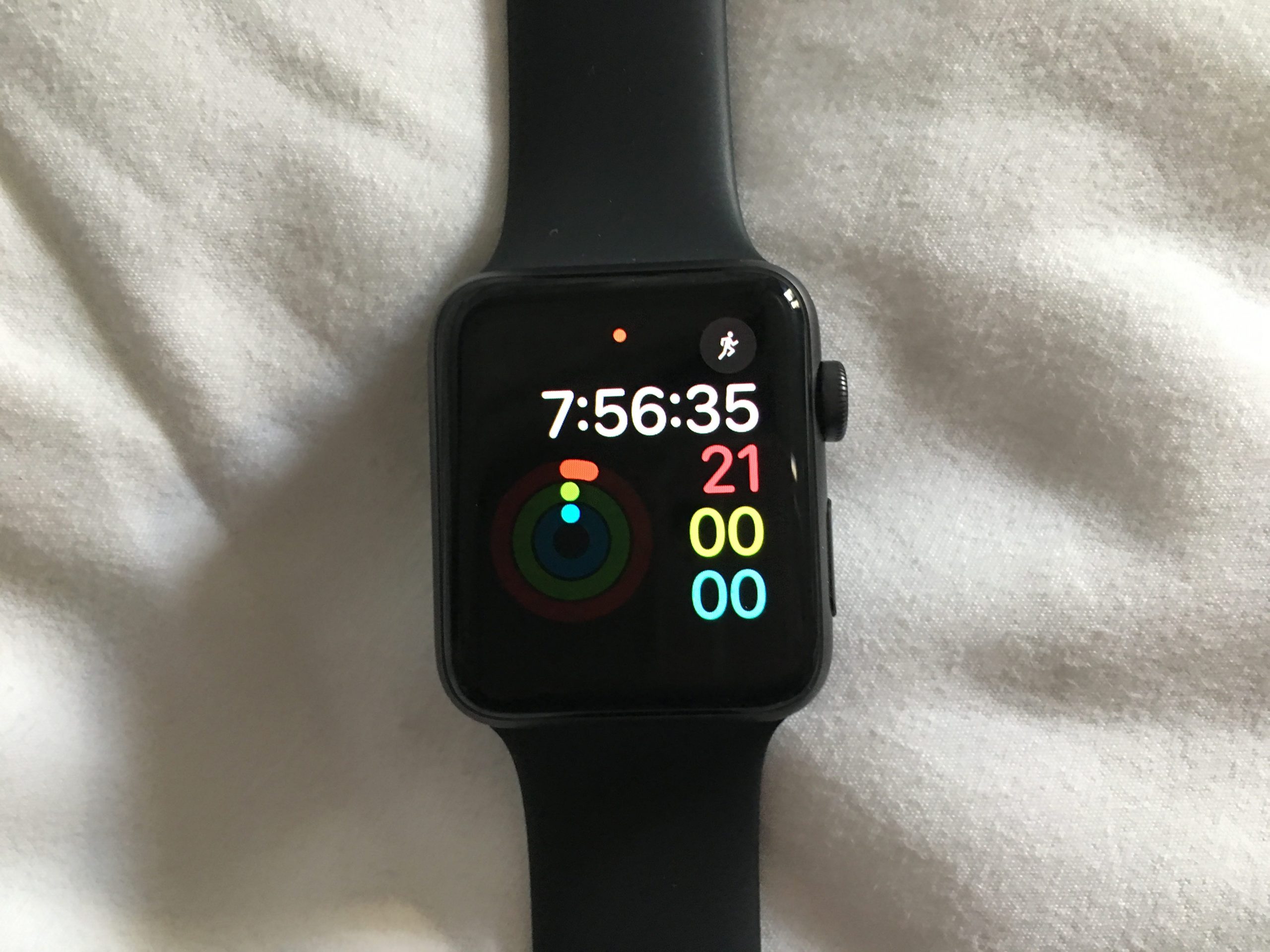 The Activity App on an Apple Watch, with a red notification dot at the top.