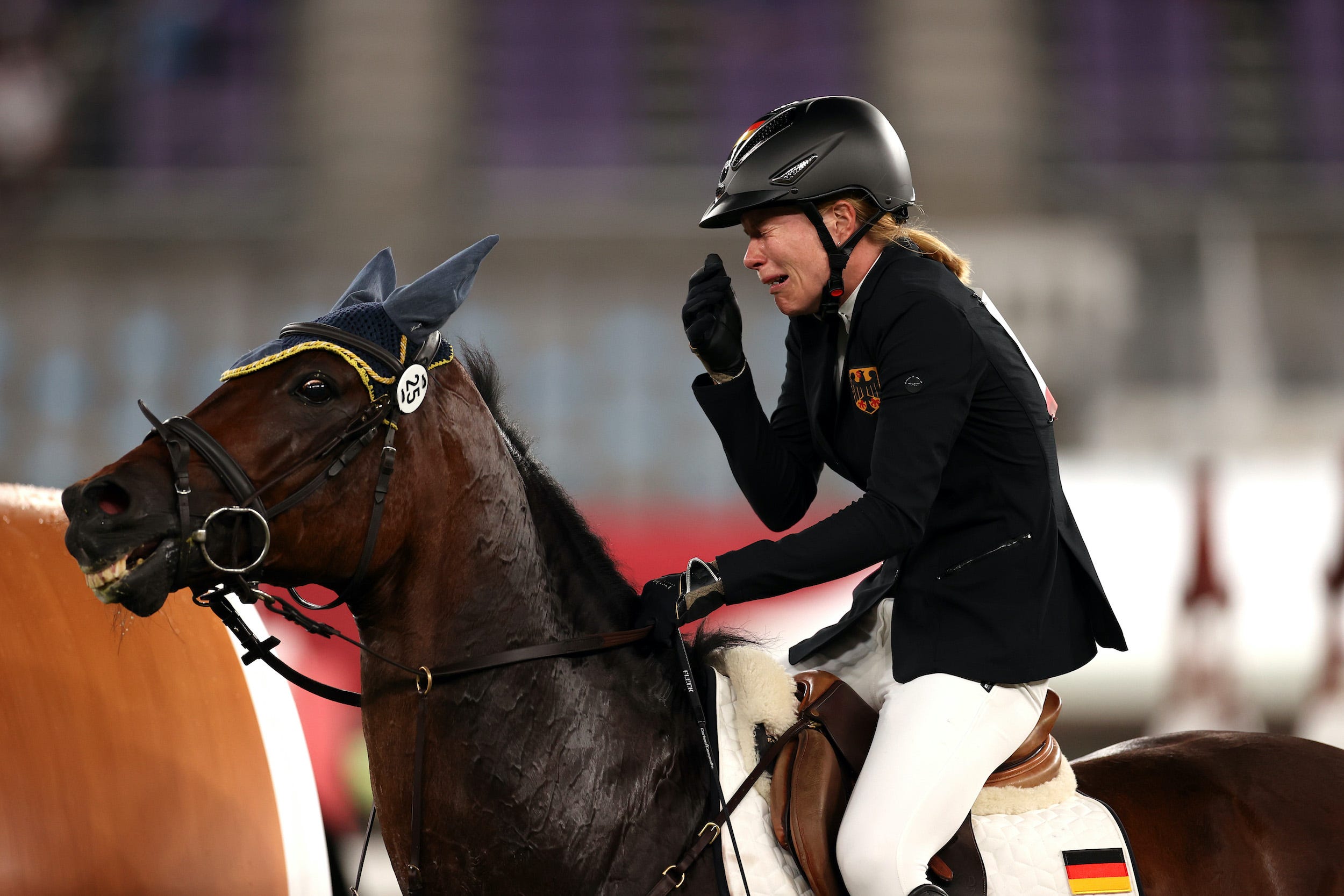 Annika Schleu of Team Germany looks dejected following her run in the Riding Show Jumping of the Women's Modern Pentathlon.