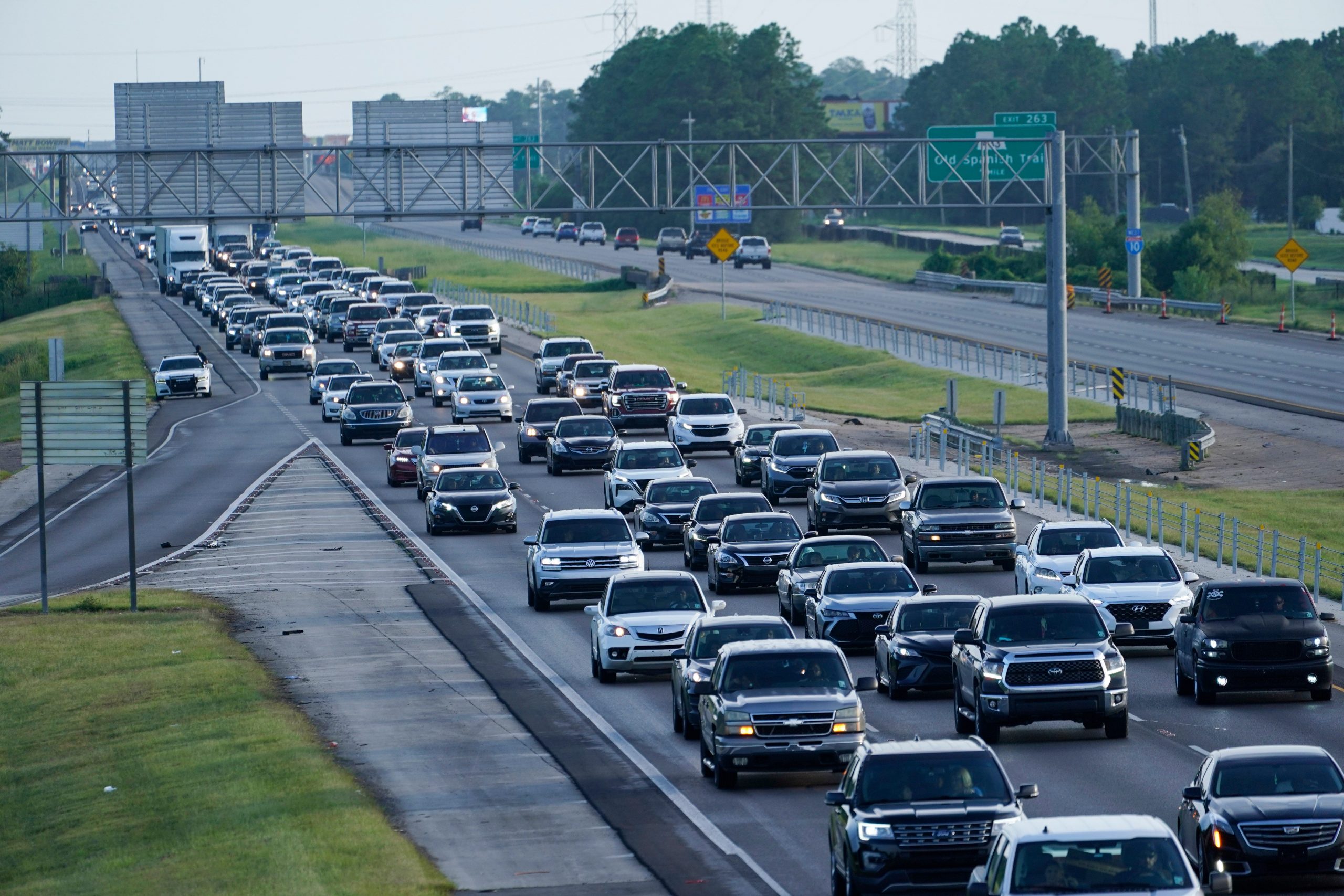 An ongoing line of cars tries to evacuate New Orleans on the highway.