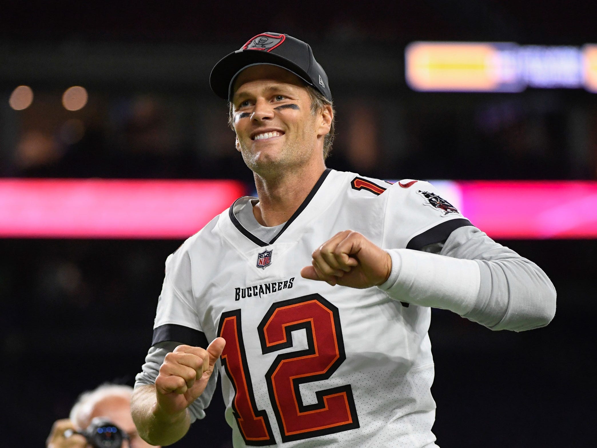 Tom Brady walks off the field after a preseason game.