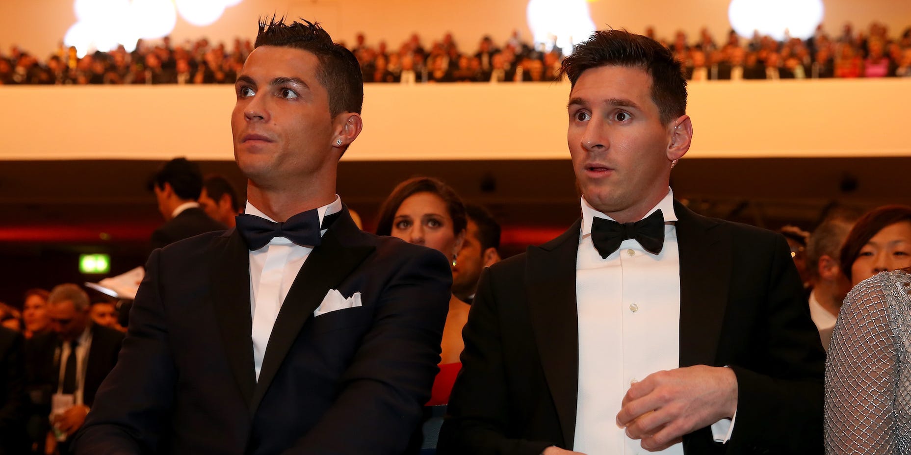 FIFA Ballon d'Or nominee Cristiano Ronaldo of Portugal and Real Madrid sits with FIFA Ballon d'Or nominee Lionel Messi of Argentina and Barcelona during the FIFA Ballon d'Or Gala 2015 at the Kongresshaus