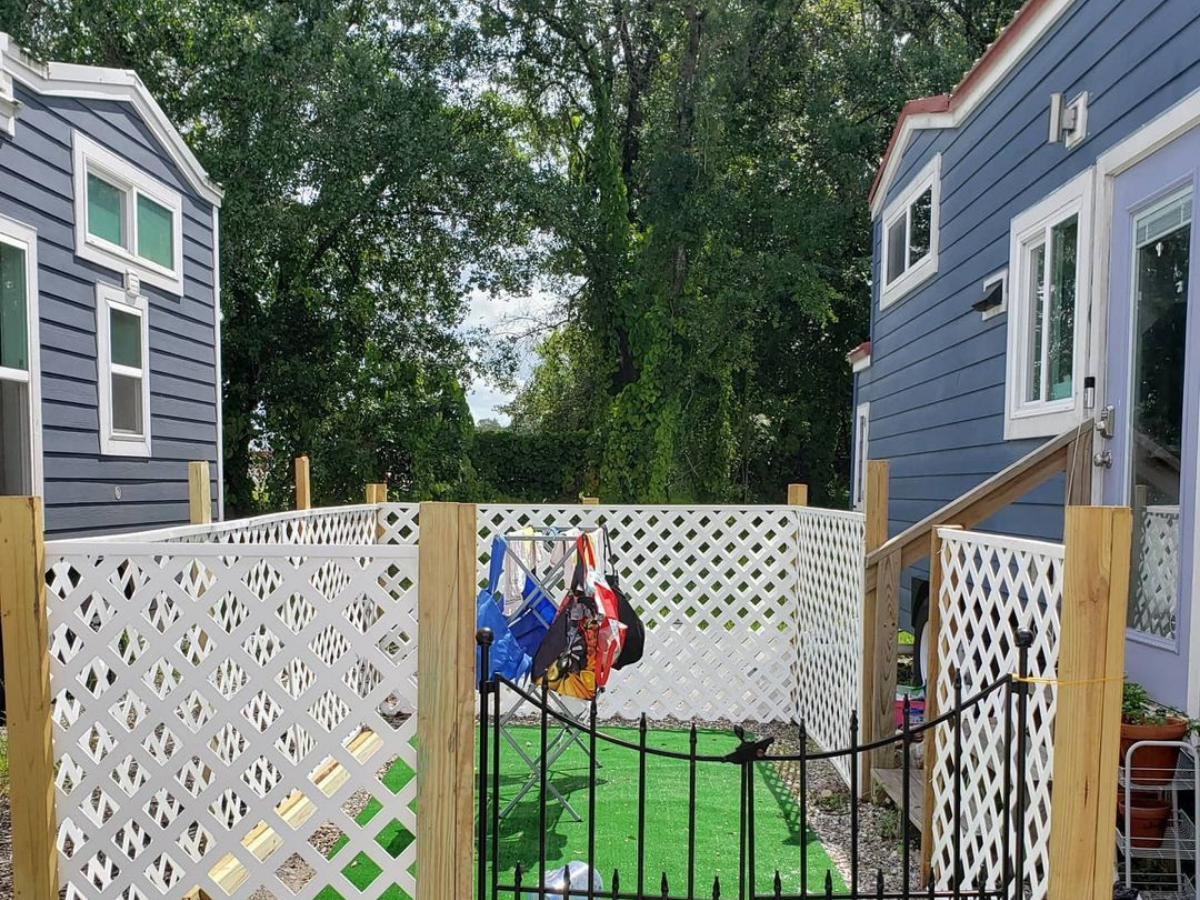 A little fenced in area is between their two homes.