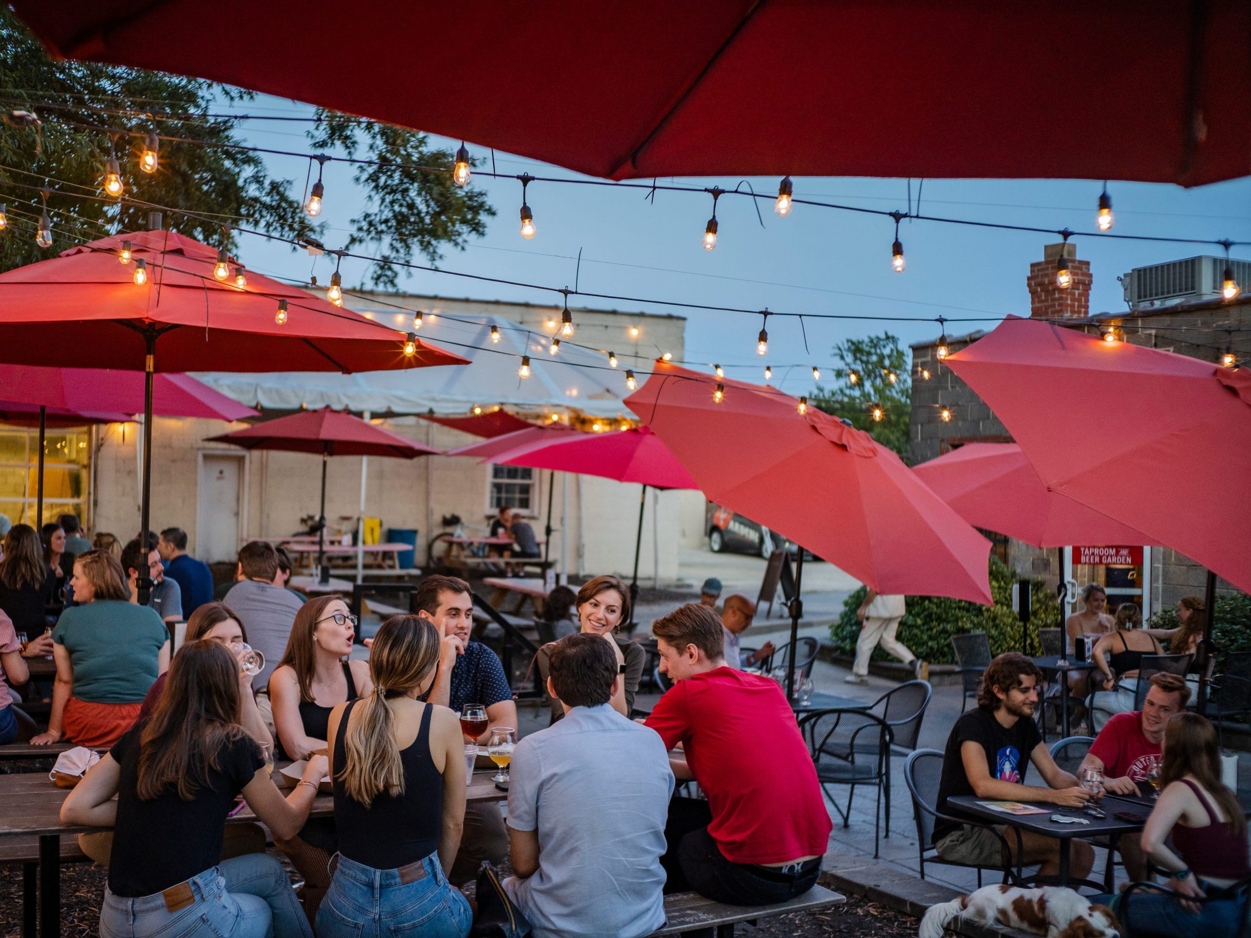 Groups of people sitting outdoors at a brewery in Richmond, Virginia.