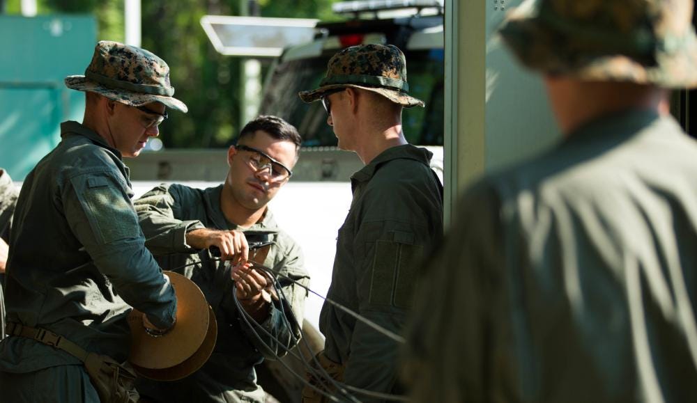 Explosive Ordnance Disposal (EOD) technicians prepare detonation cord during an EOD practice event at Marine Corps Air Station (MCAS) Cherry Point, North Carolina, Aug. 12, 2021