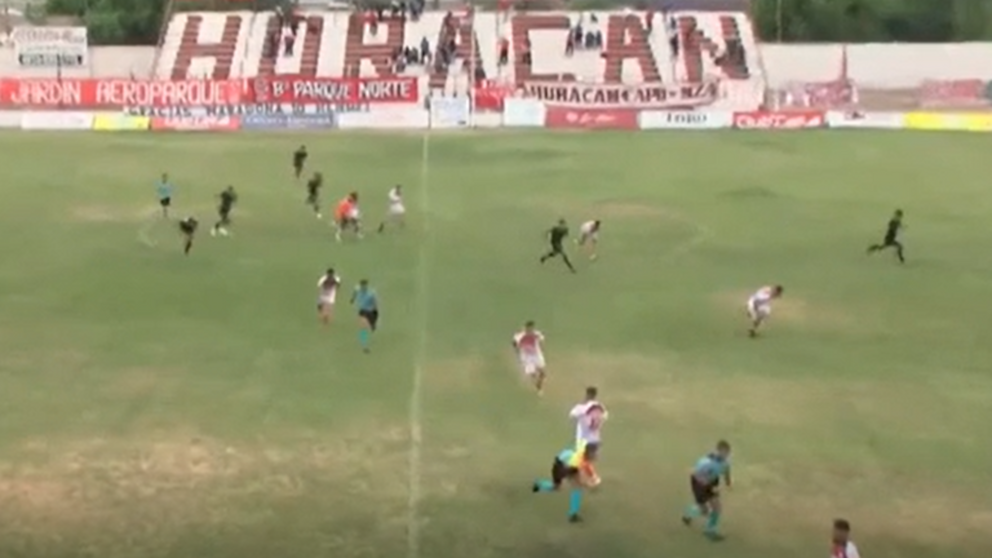 Players run from the field as the coach of an Argentine soccer team was shot during a match