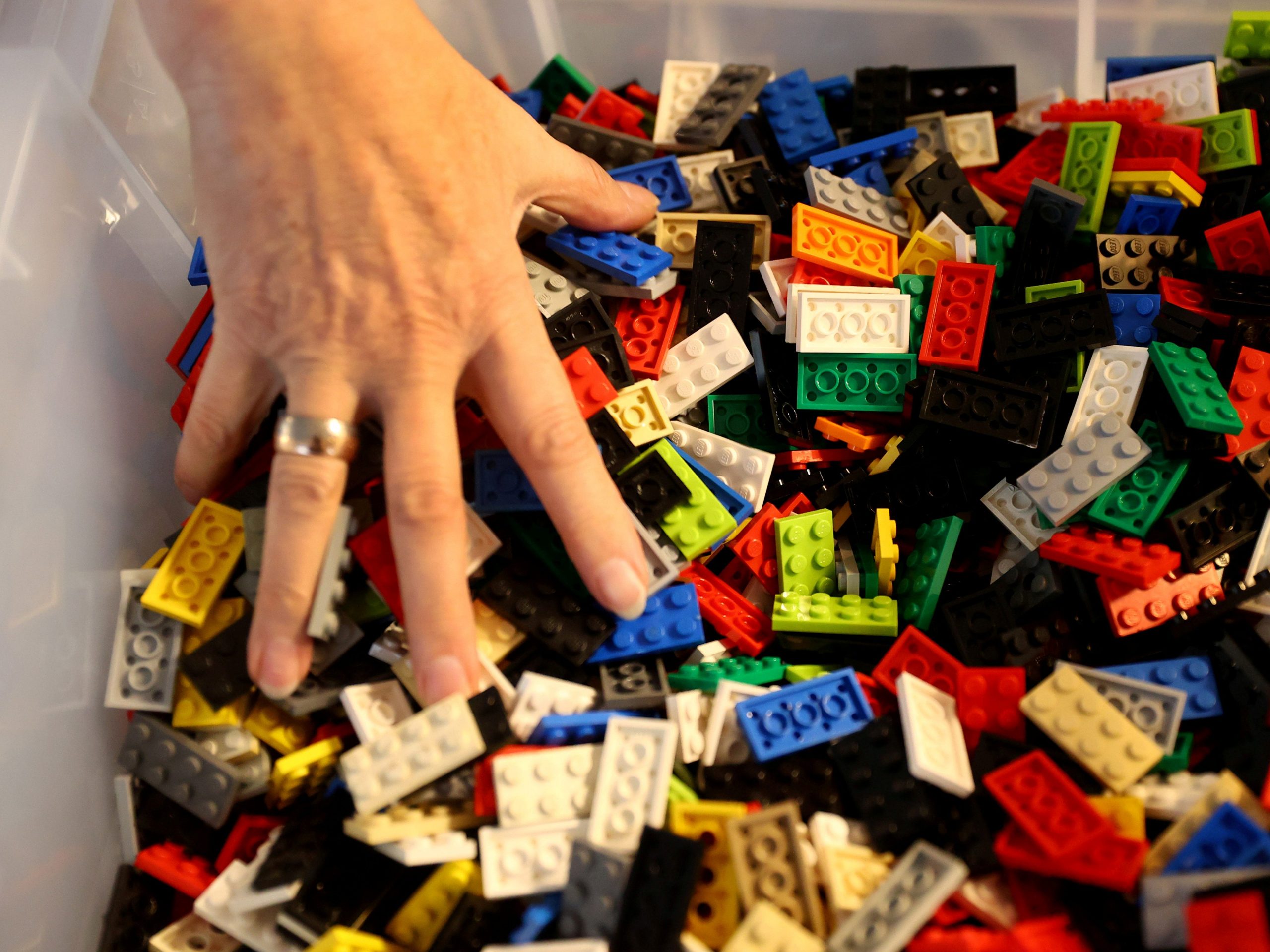 FILE PHOTO: Rita Ebel, nicknamed "Lego grandma", builds a wheelchair ramp from donated Lego bricks in the living room of her flat in Hanau, Germany, February 17, 2020. Picture taken February 17, 2020. Ebel started to build the ramps almost one year ago to raise awareness for handicapped people in her hometown of Hanau. Meanwhile, dozens of stores use the ramps to ease entry for wheelchair users.  REUTERS/Kai Pfaffenbach/File Photo