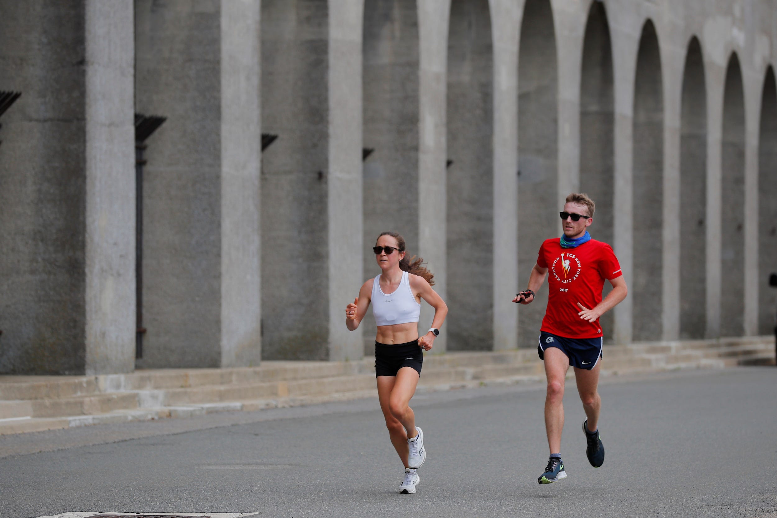 Molly Seidel (left) runs alongside her coach, Jon Green.