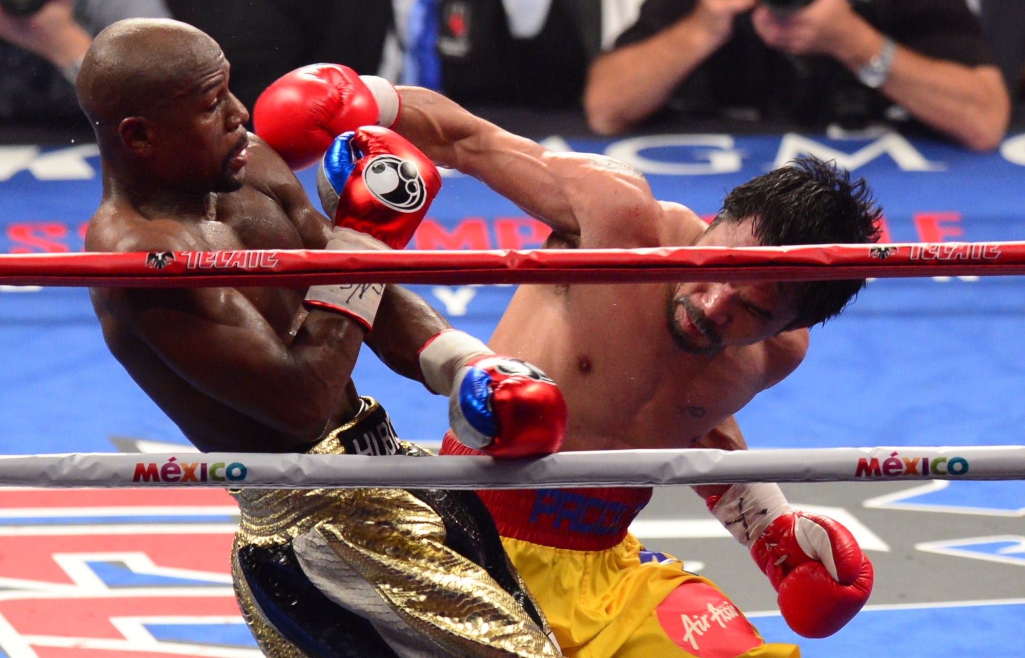 Floyd Mayweather Jr. evades one of Manny Pacquiao's punches during their 2015 fight.