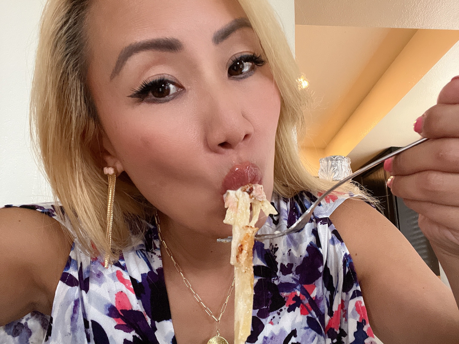 Freelancer Kaila Yu eating Chrissy Teigen's pasta.