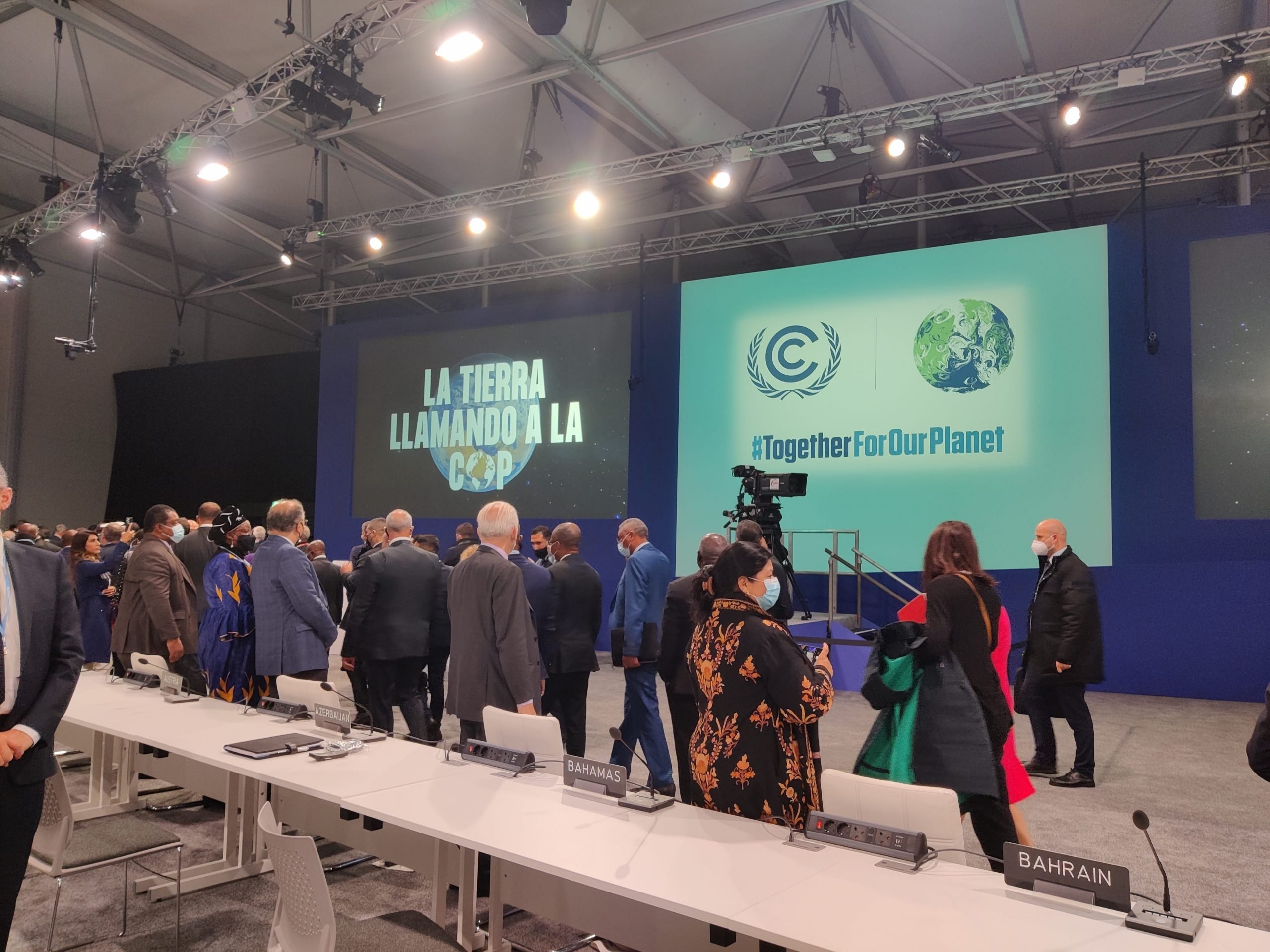 Delegates meeting in a conference room at COP26.