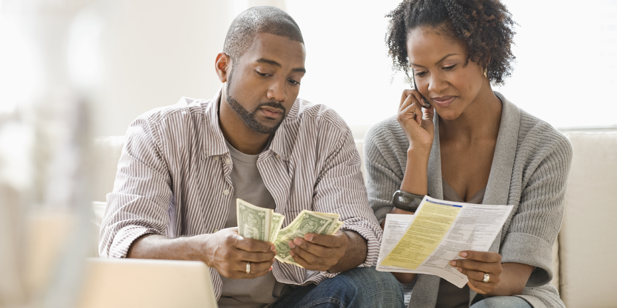 Photo of a couple paying bills.