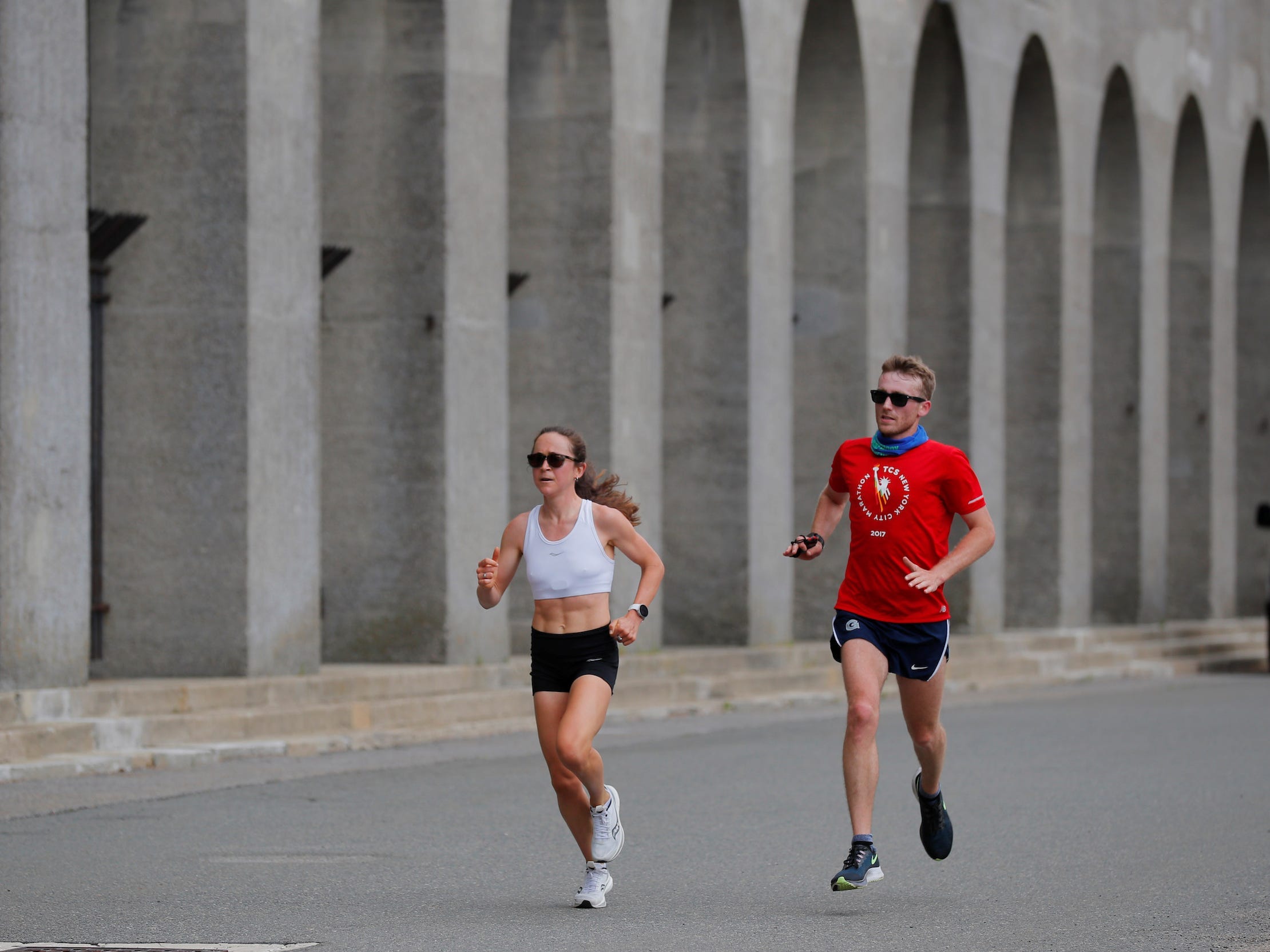 Molly Seidel (left) runs alongside her coach, Jon Green.