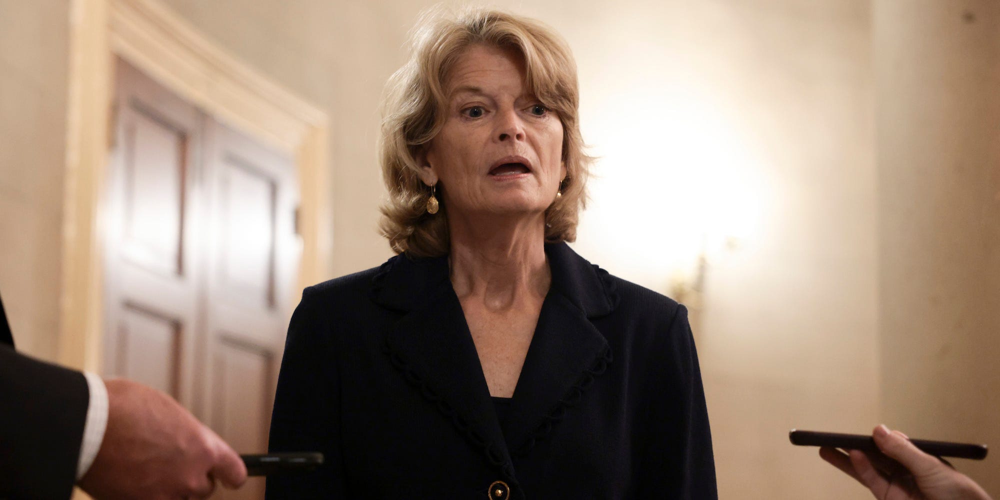 Sen. Lisa Murkowski (R-AK), wearing a black suit jacket while speaking to reporters at the Capitol