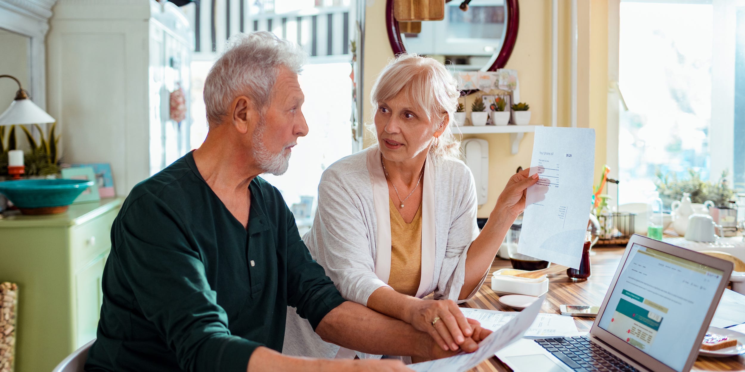Senior couple review finances at home