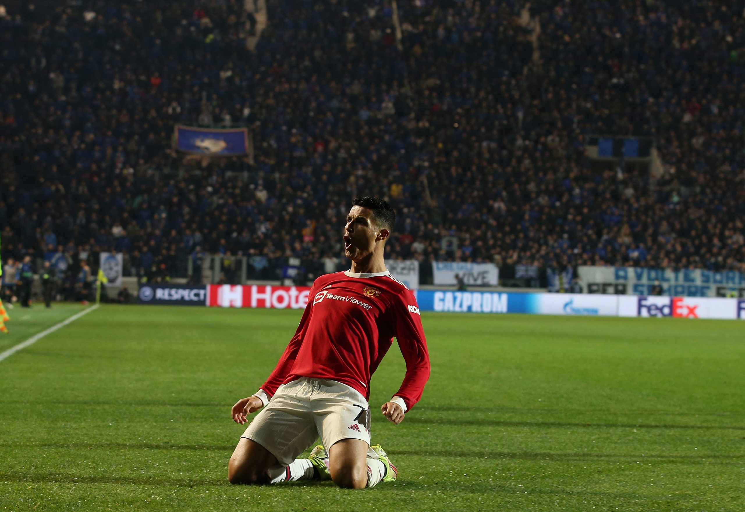 Cristiano Ronaldo celebrates after scoring a stoppage-time equalizer against Atalanta