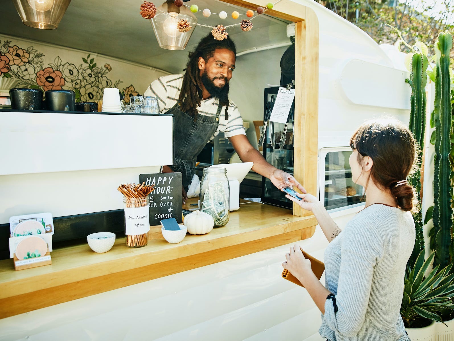 food truck owner taking credit card for payment from customer