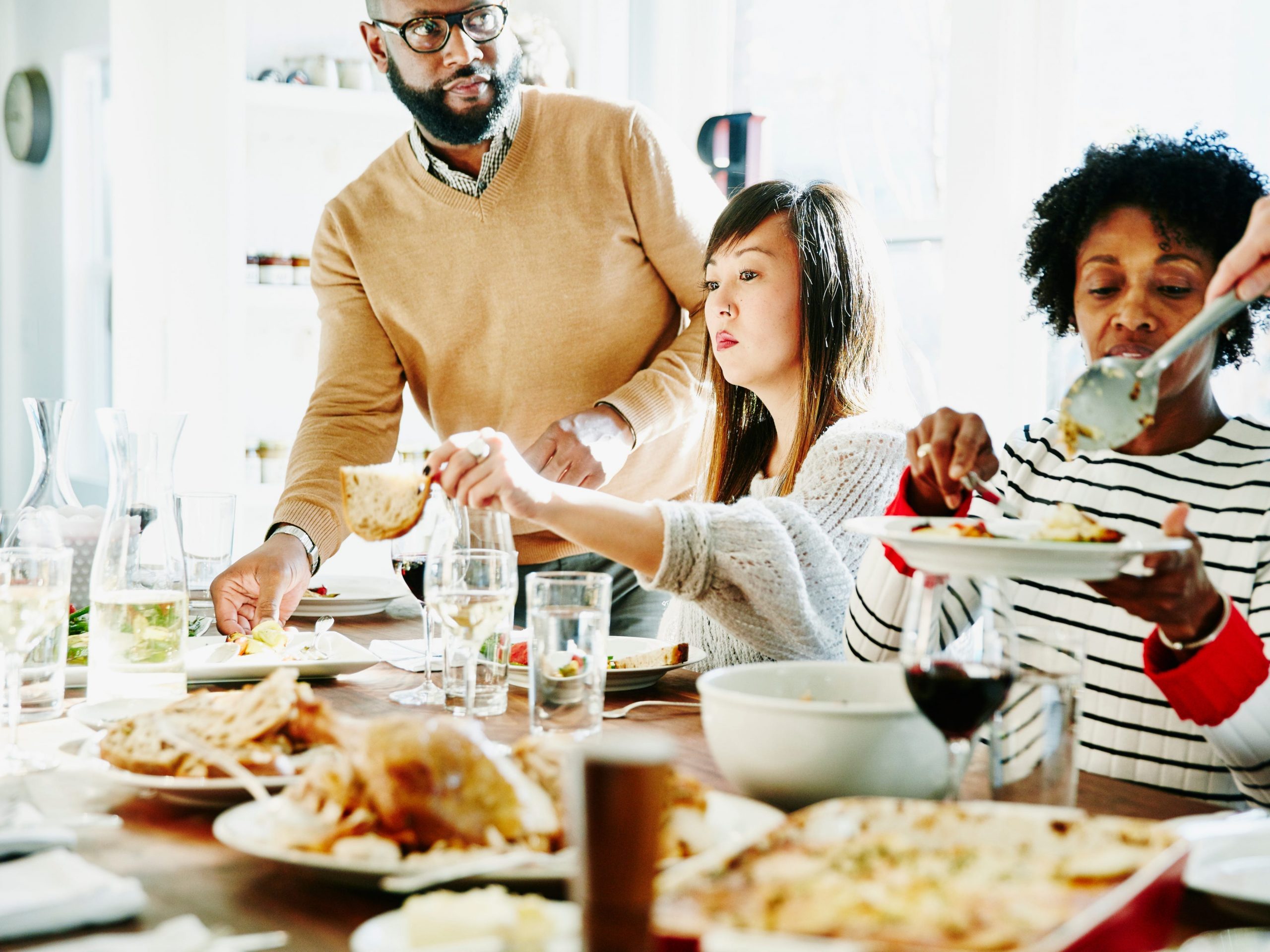 A family enjoying Thanksgiving dinner together.