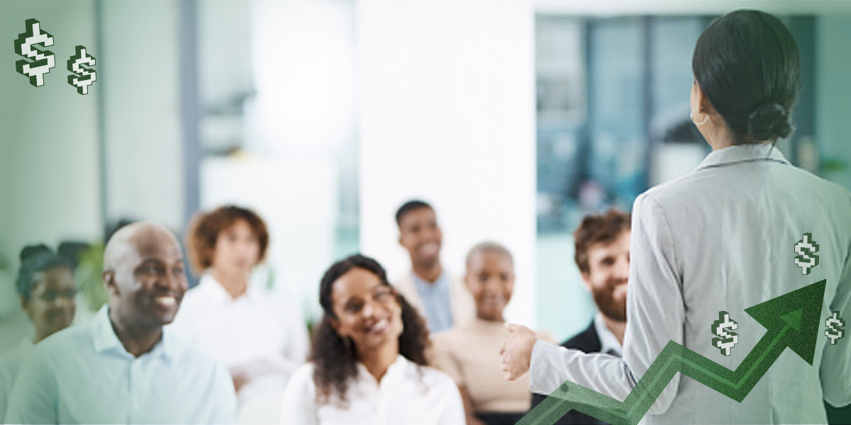 A photo of a manager addressing a group of employees.