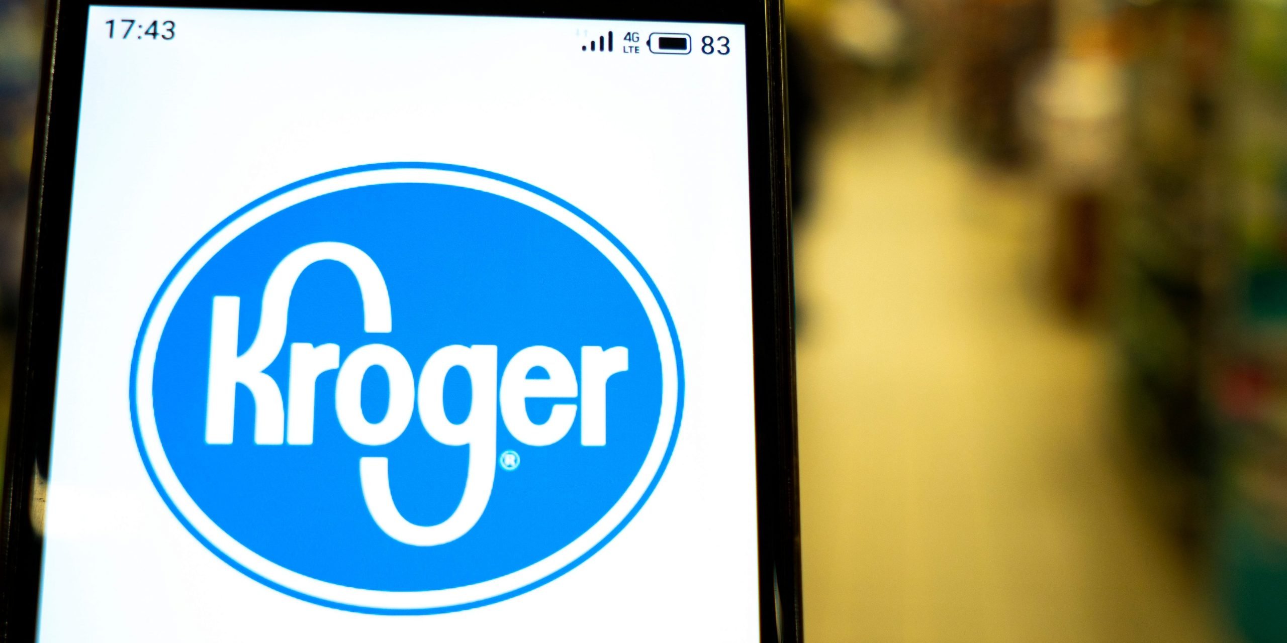 In this photo illustration the Kroger logo is seen displayed on a smartphone.