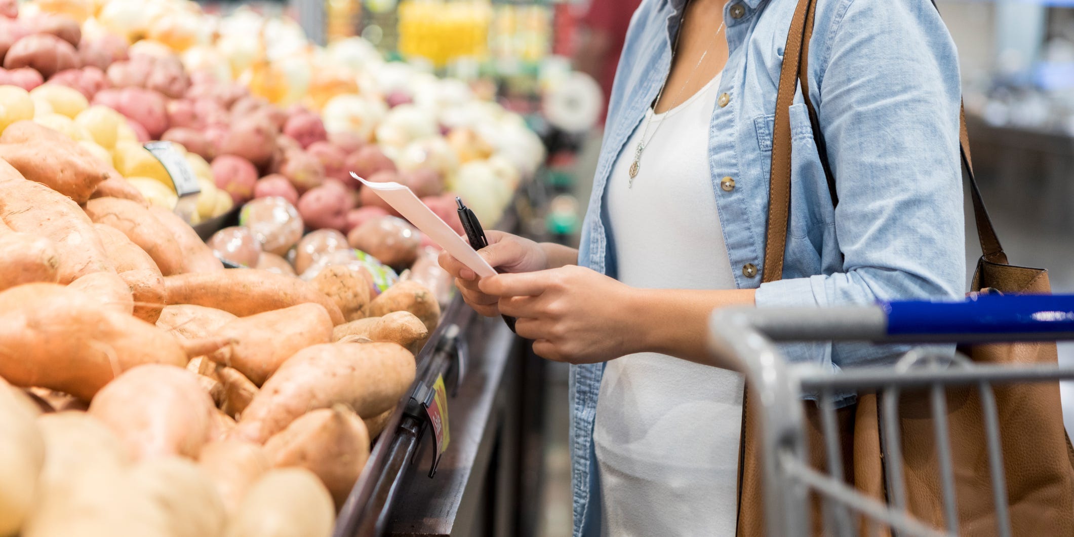 Someone shopping for potatoes.