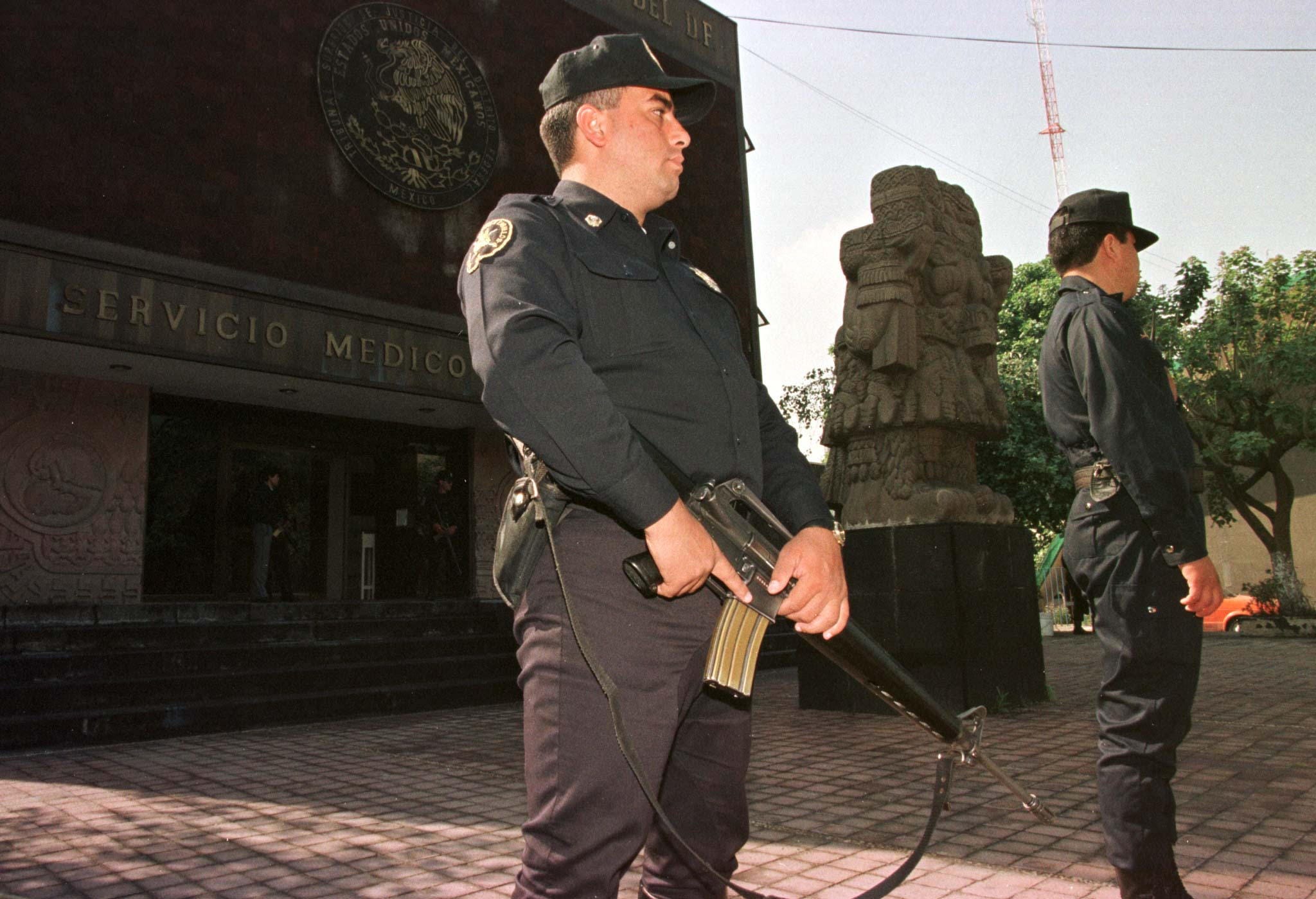 Two police are seen in front of a morgue.