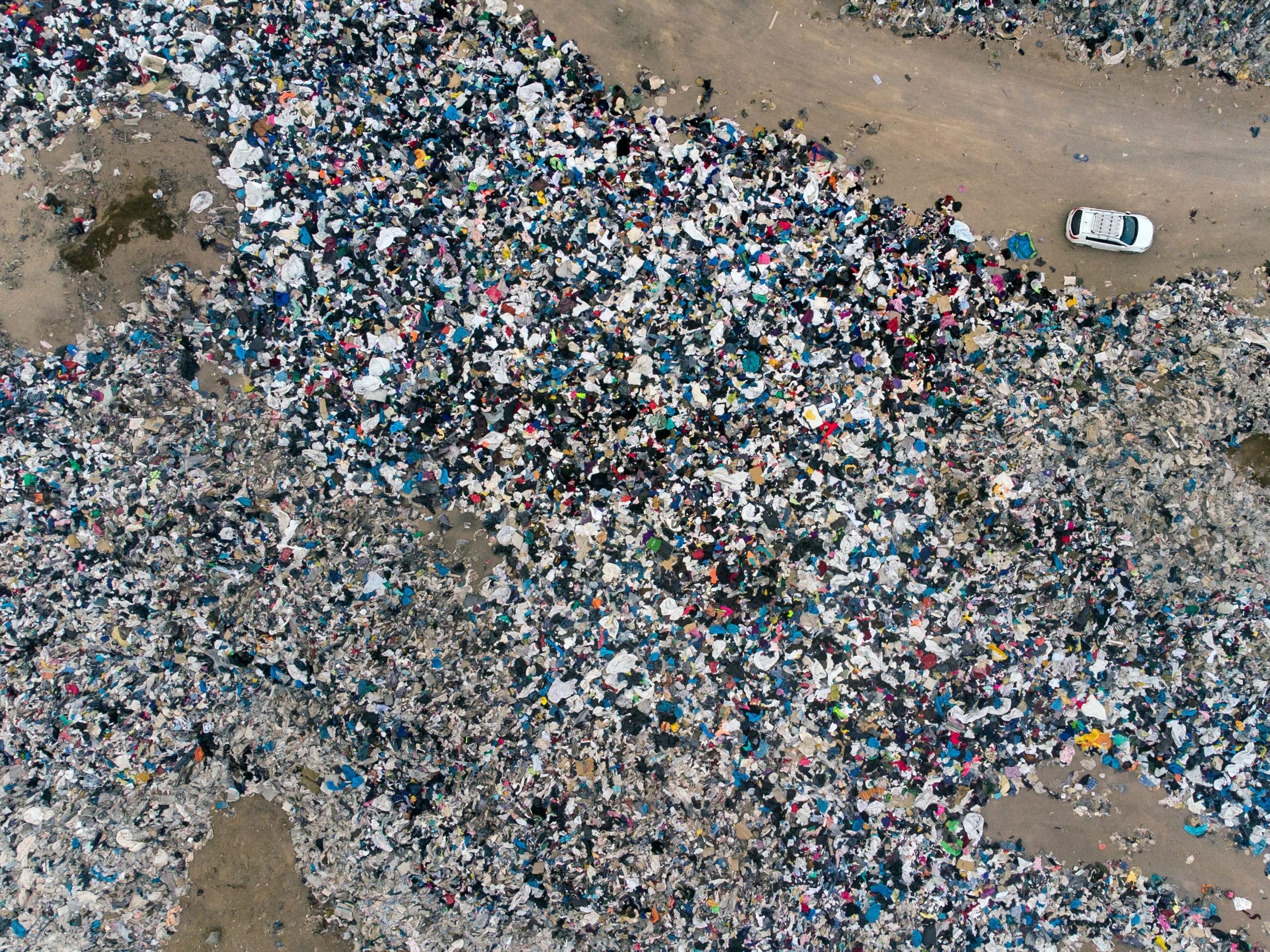 aerial view used clothes fast fashion atacama desert chile