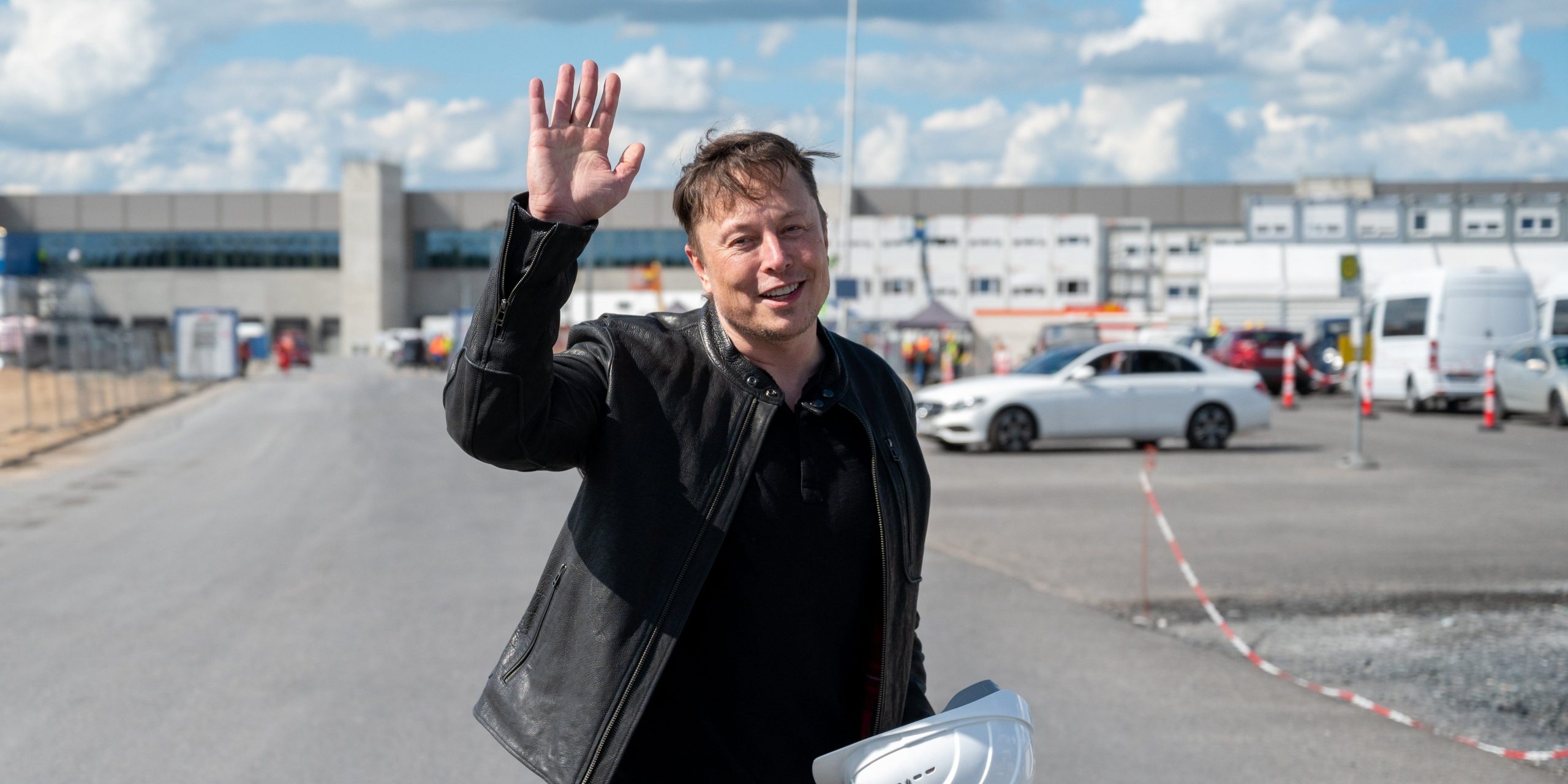 Elon Musk, Tesla CEO, stands on the construction site of the Tesla factory and waves, in Grünheide near Berlin, on  May 17, 2021.