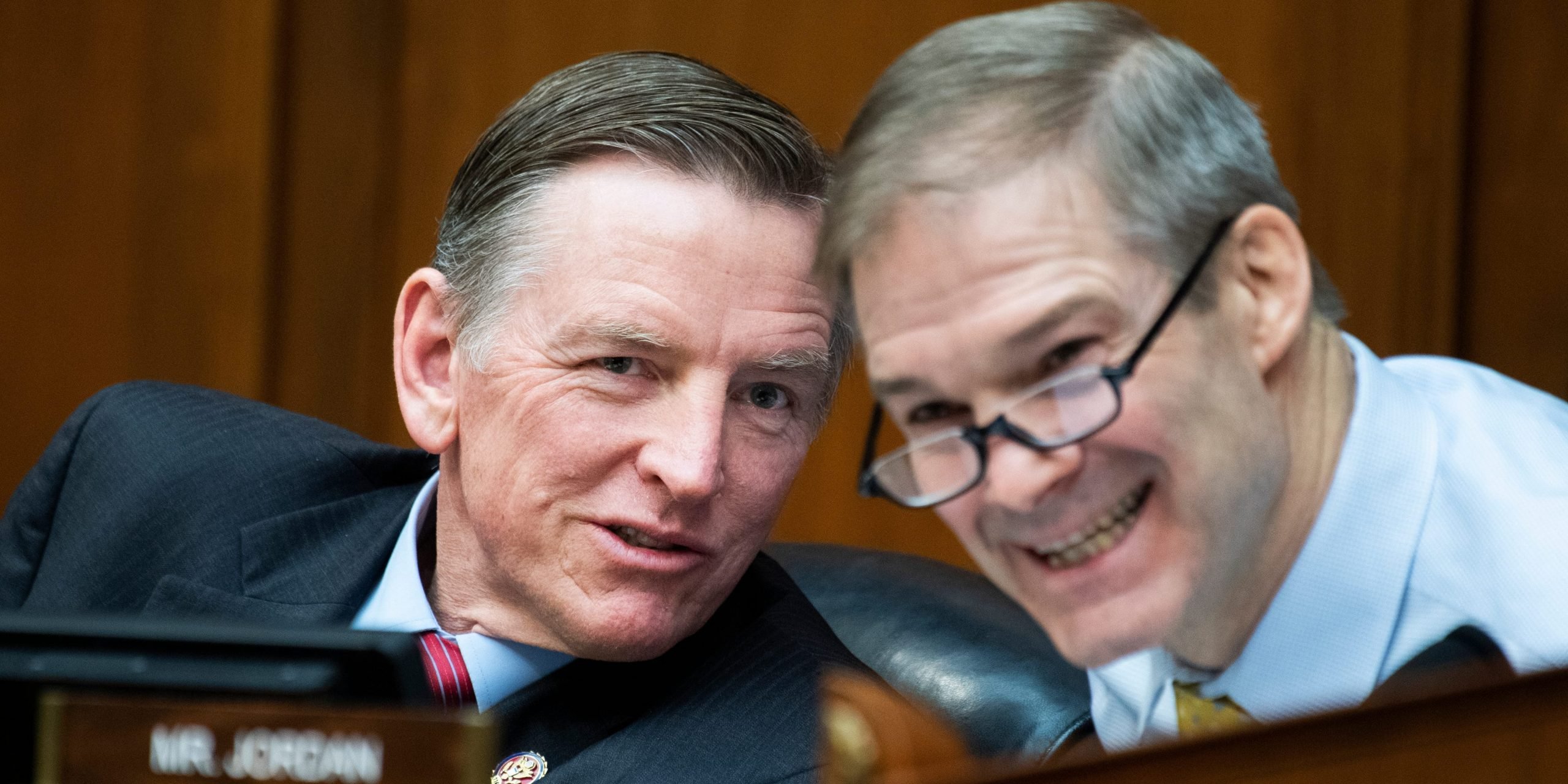 Republican congressman Jim Jordan and Paul Gosar speak at a Congressional hearing.