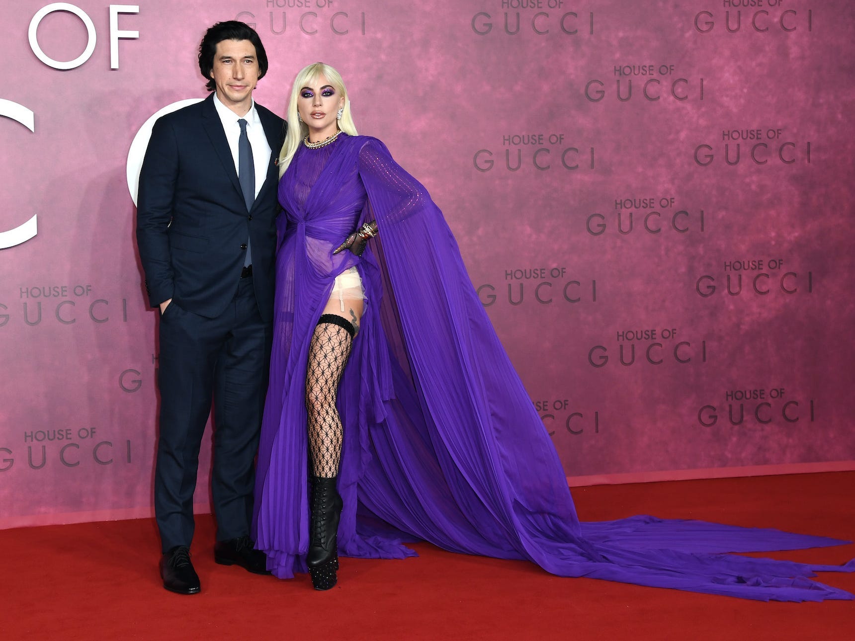 Adam Driver and Lady Gaga pose on the "House of Gucci" red carpet.