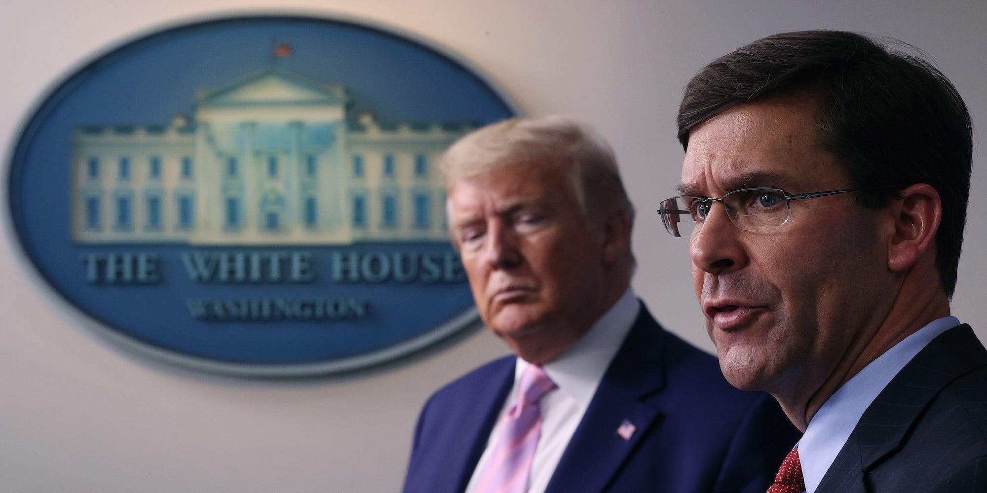 Then-Secretary of Defense Mark Esper speaks as then-President Donald Trump listens during a daily White House coronavirus press briefing on April 1, 2020.