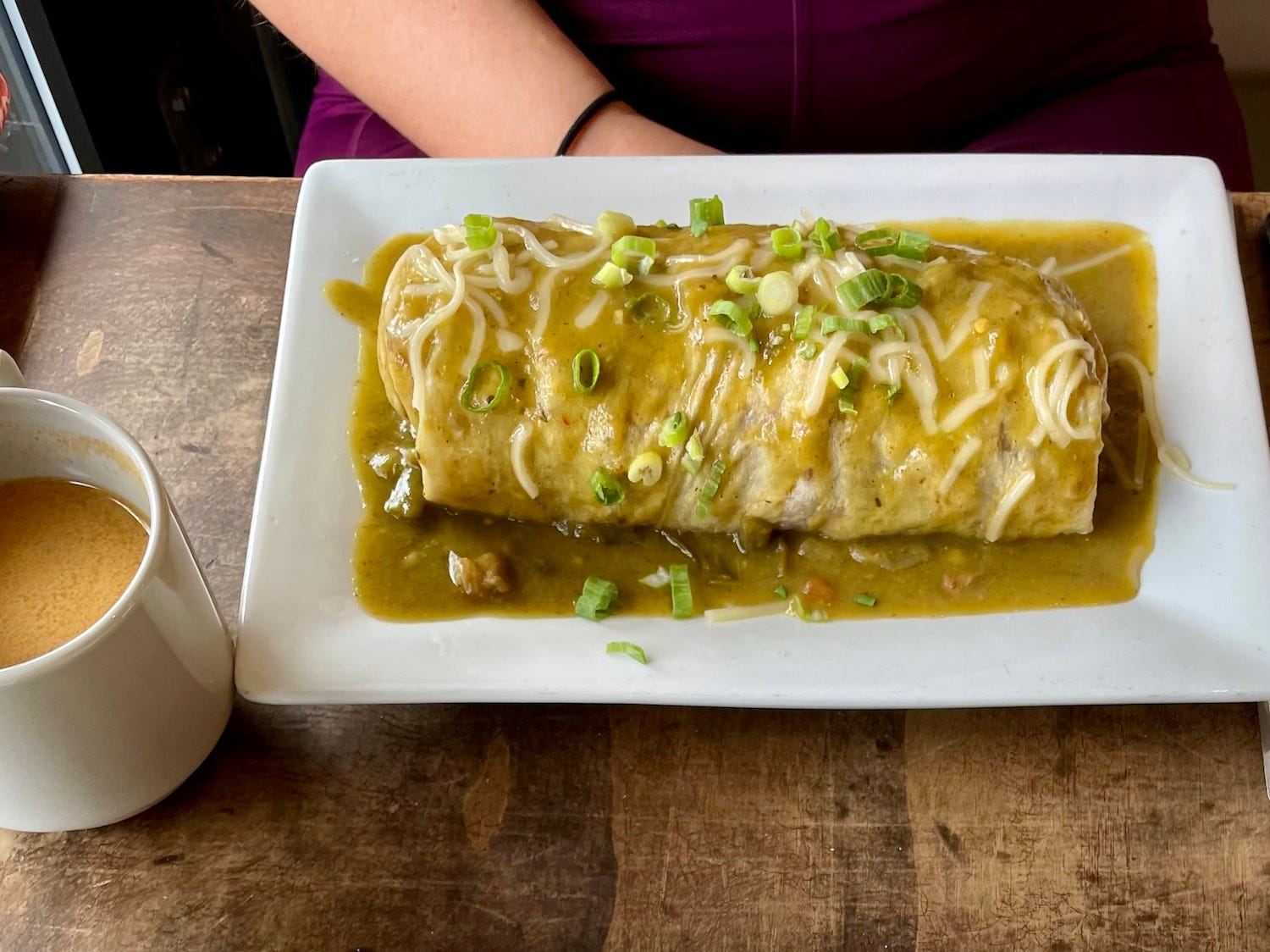 The breakfast burrito smothered in green chile at Onefold.