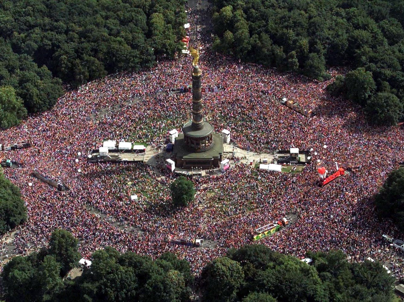 An aerial view shows ravers dancing around the Column of Victory during the 13th annual Love Parade with the motto "Join your love republic" in Berlin, July 21, 2001. Several hundred thousands ravers party between Brandenburg Gate and the Column of Victory.