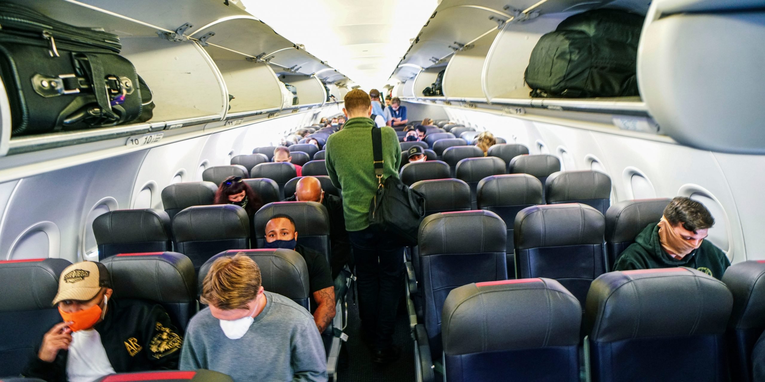Passengers sit in an American Airlines airplane before flying from California to North Carolina