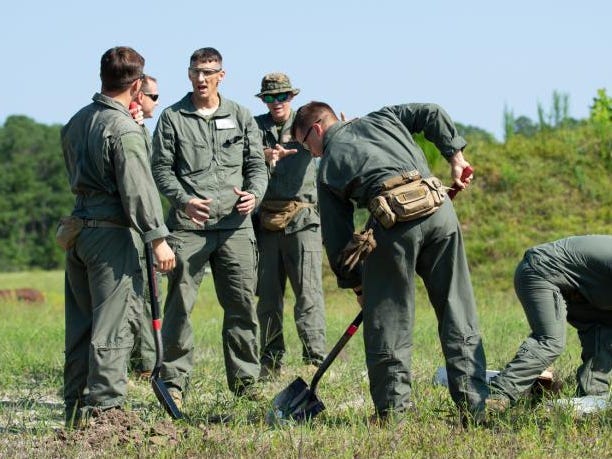 Marine Corps Chief Warrant Officer 5 Michael Gaydeski, the officer in charge for Headquarters and Headquarters Squadron Explosive Ordnance Disposal (EOD), goes over standard operating procedures with EOD technicians during a practice event at Marine Corps Air Station (MCAS) Cherry Point, North Carolina, Aug. 12, 2021.