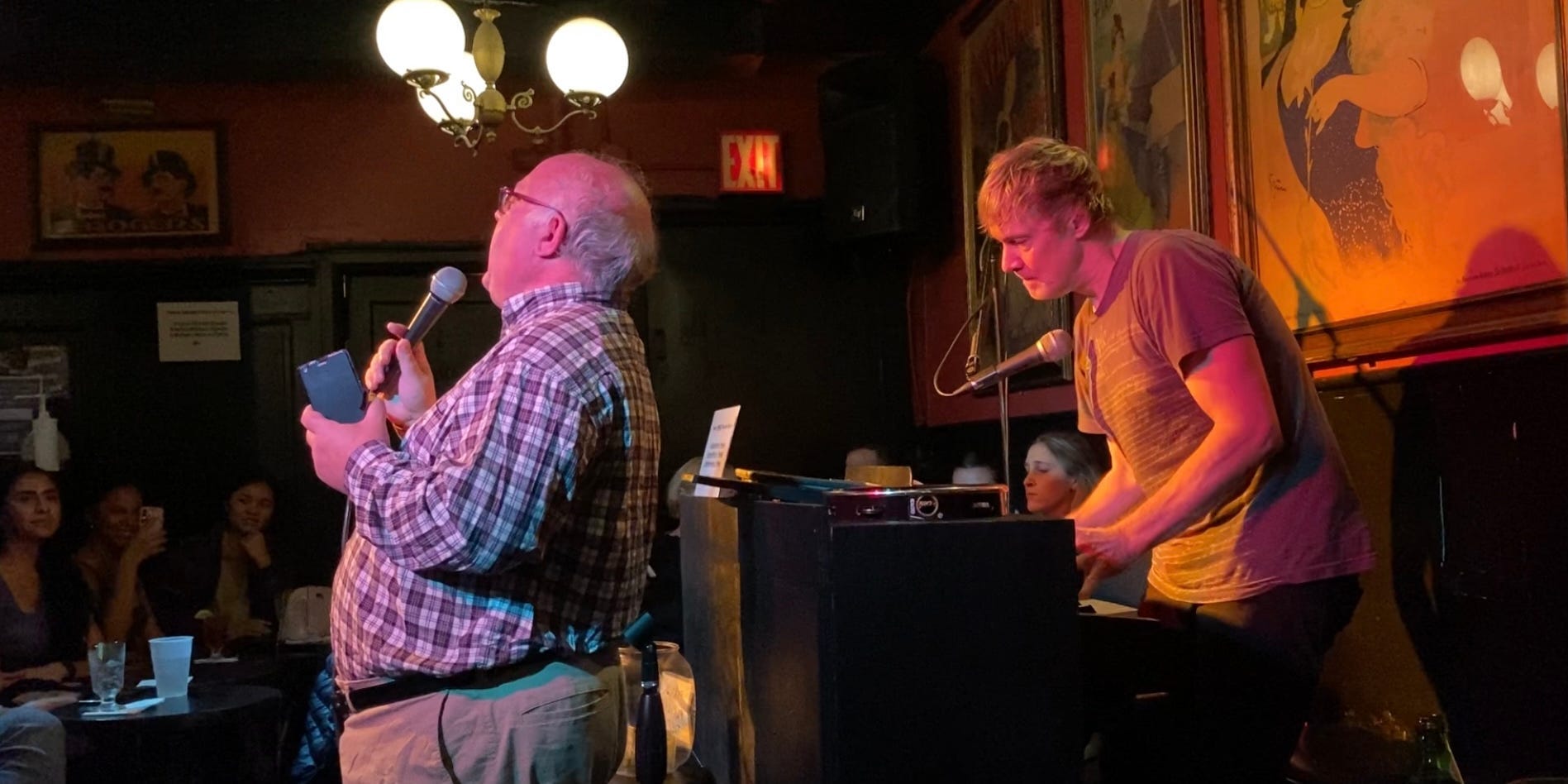 A talented guest sings at Brandy's Piano Bar, while Isaacs plays piano.