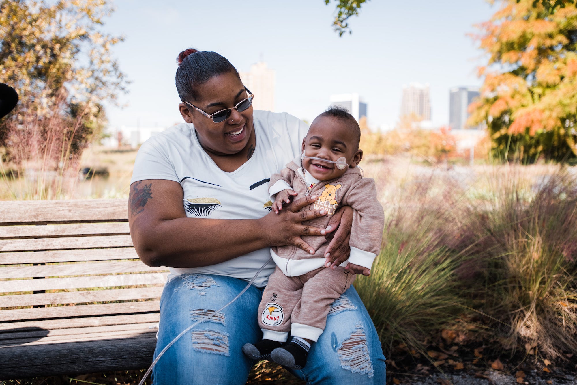 Curtis Means being held by his mother, Michelle Butler.