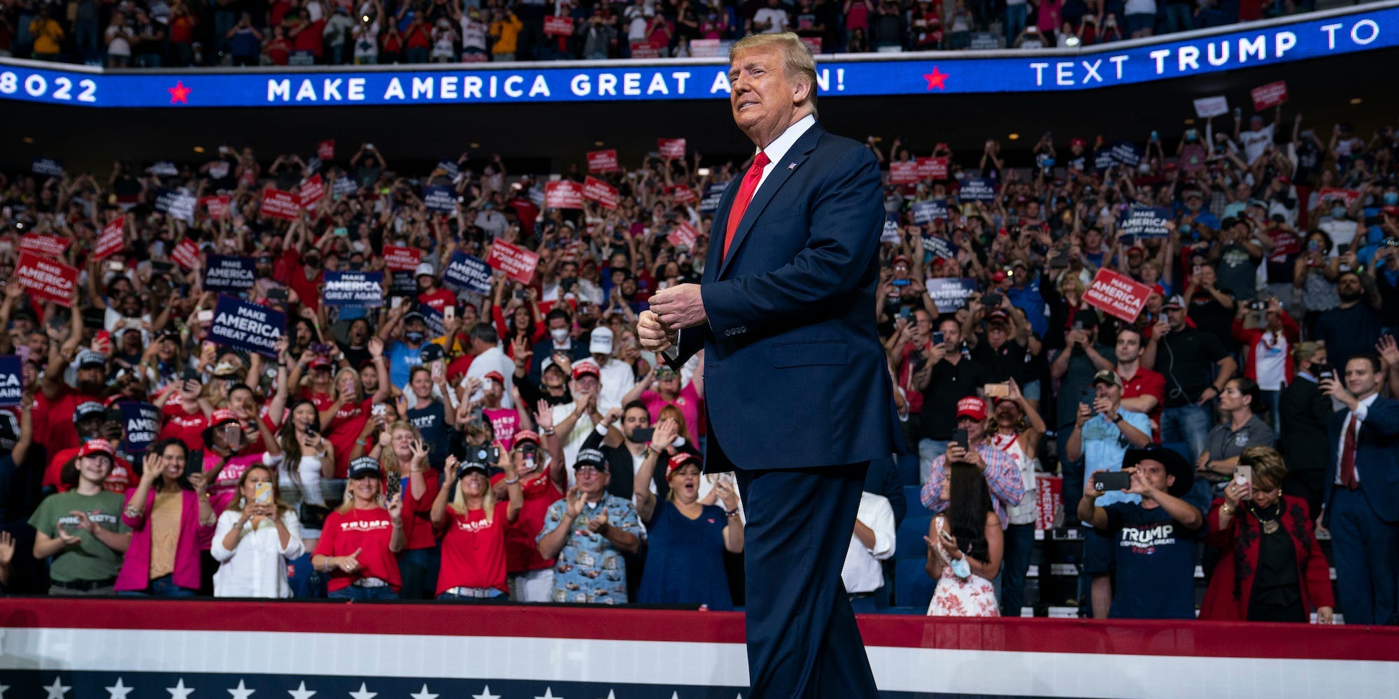 In this June 20, 2020, file photo President Donald Trump arrives on stage to speak at a campaign rally at the BOK Center in Tulsa, Okla.