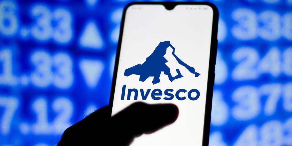the Invesco logo seen displayed on a smartphone.