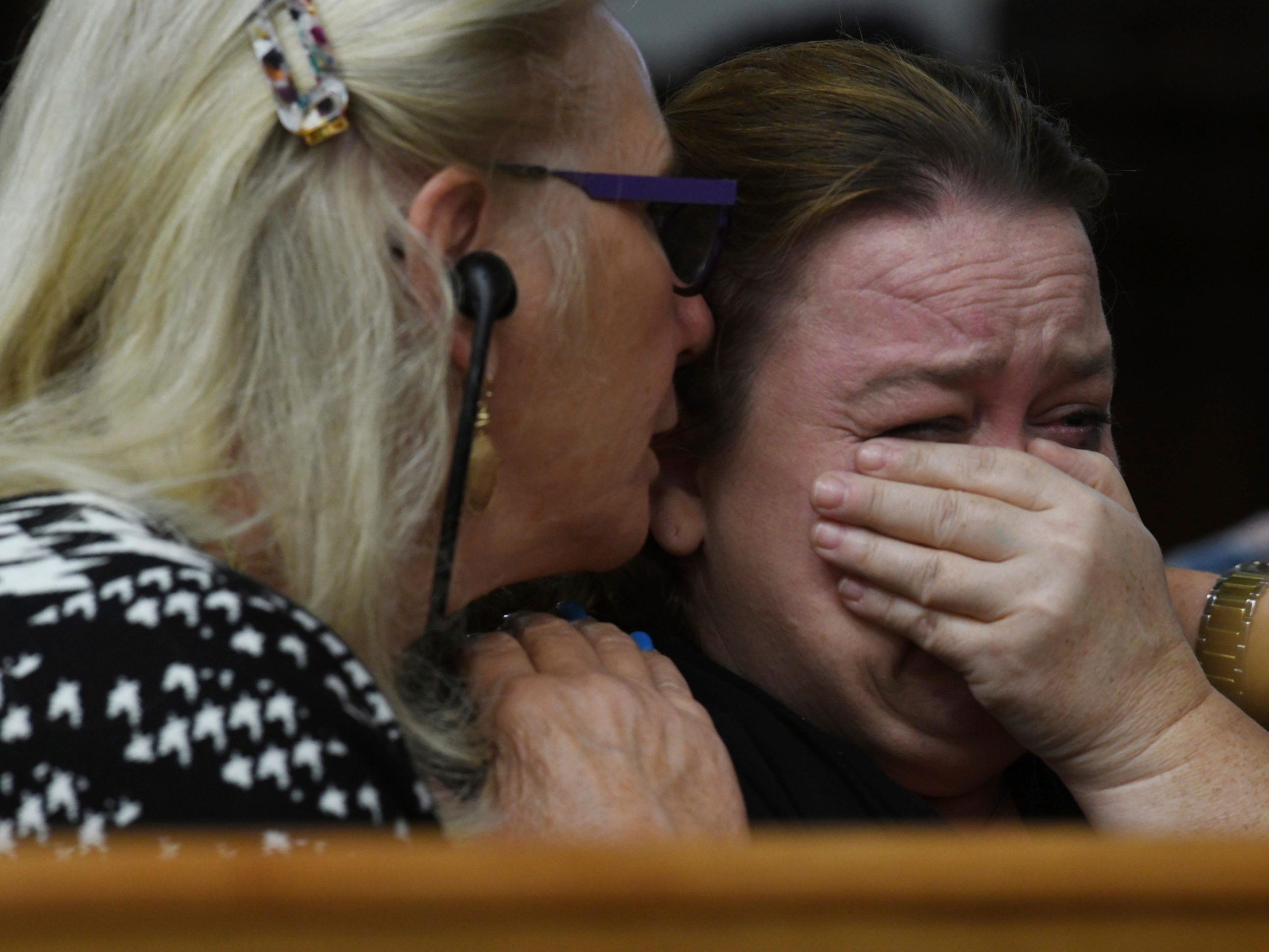 Wendy Rittenhouse, comforted by defense jury expert Jo-Ellan Dimitrius, gets emotional as her son Kyle Rittenhouse testifies during cross examination in his trial at the Kenosha County Courthouse in Kenosha, Wis., on Wednesday, Nov. 10, 2021.