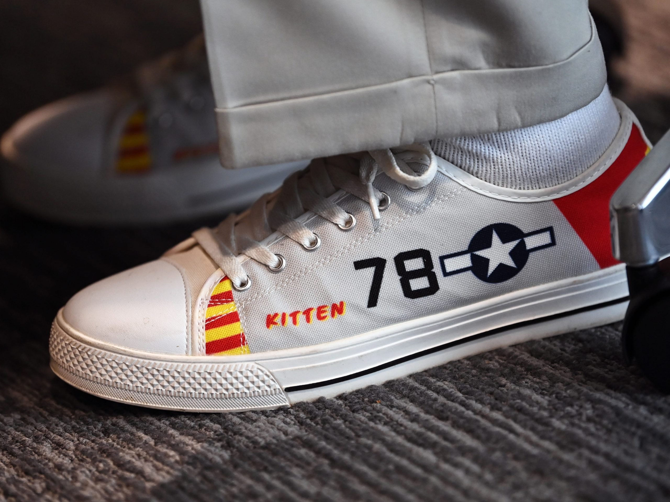 A shoe detailing the plane number and nickname of a Tuskegee Airman