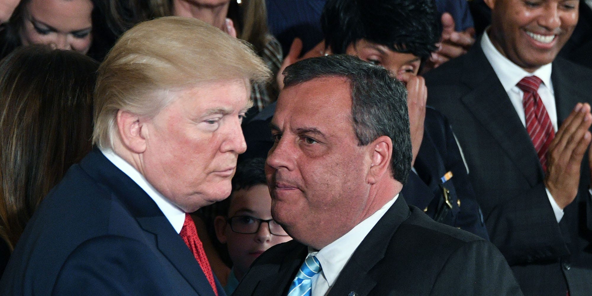 Former New Jersey Gov. Chris Christie speaks with former President Donald Trump at a White House event on October 26, 2017.