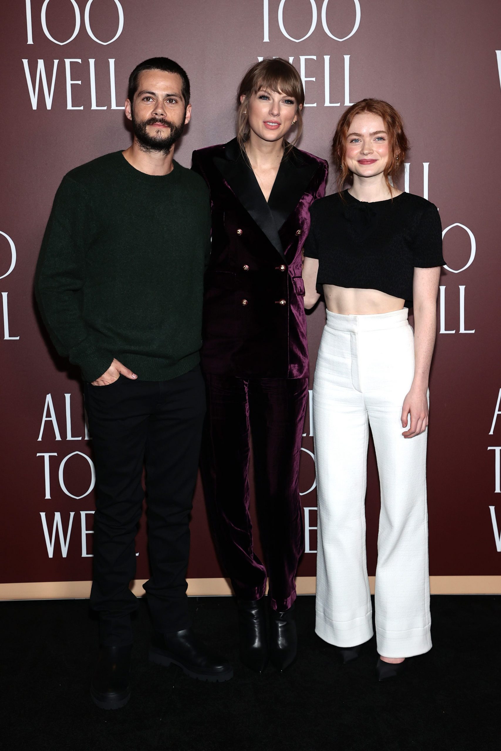 Dylan O'Brien, Taylor Swift, and Sadie Sink smile on the "All Too Well" red carpet.