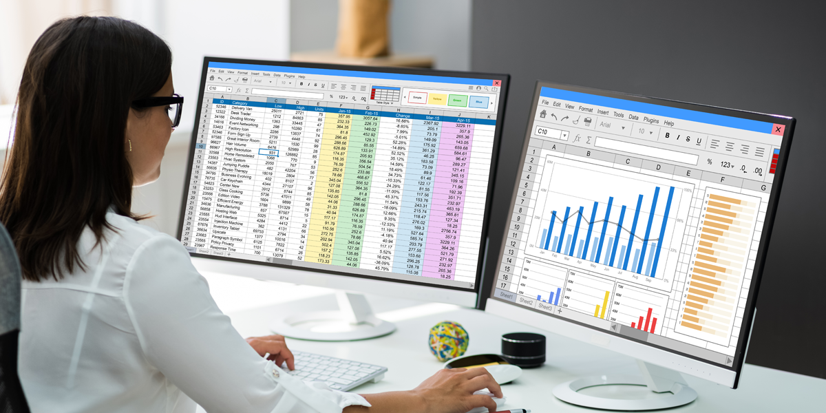 A photo of a woman working on financial spreadsheets.