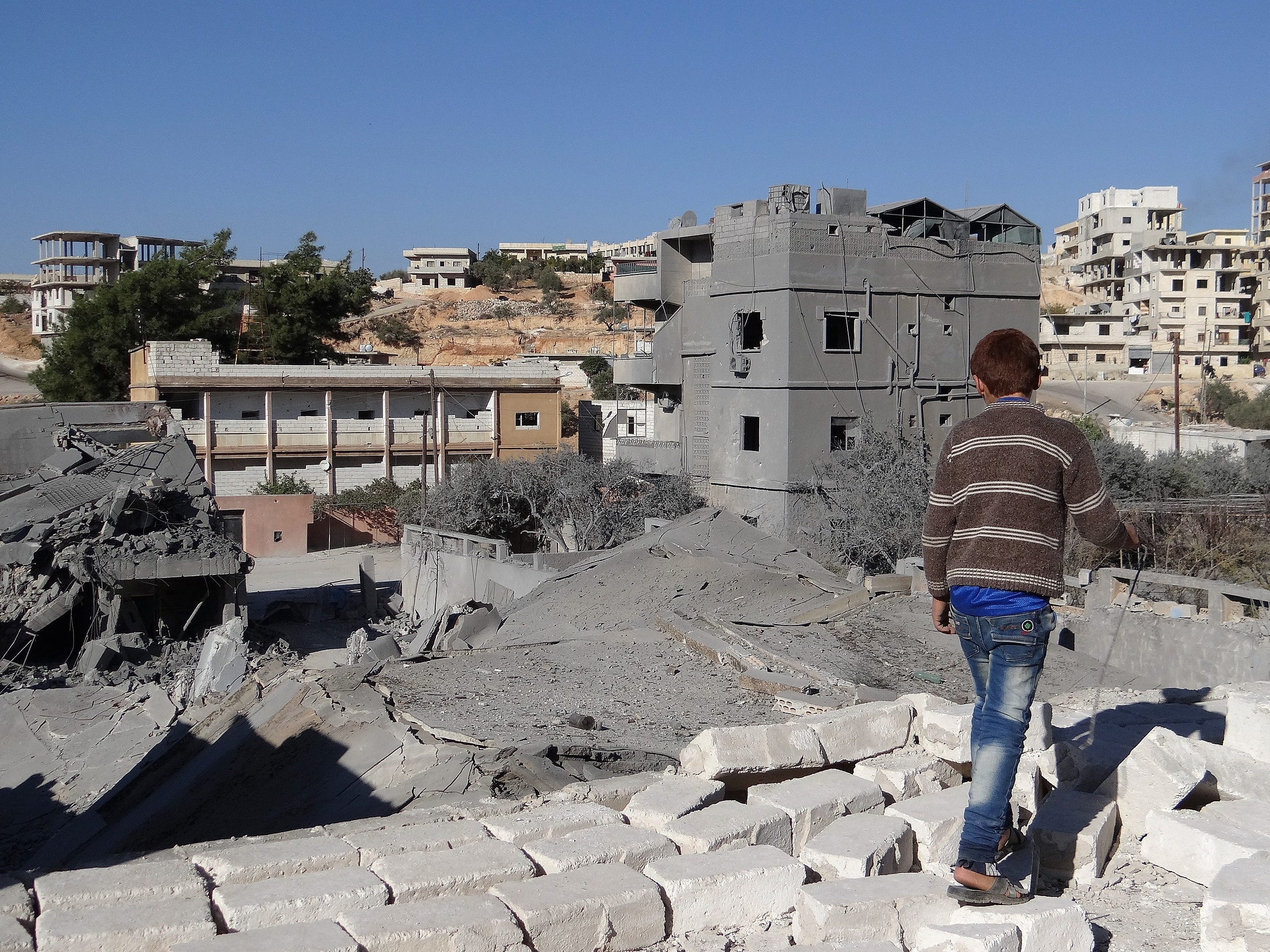 Debris are seen following a US-led coalition airstrike hits Headquarters of al Nusra Front in Aleppo, Syria on November 06, 2014.