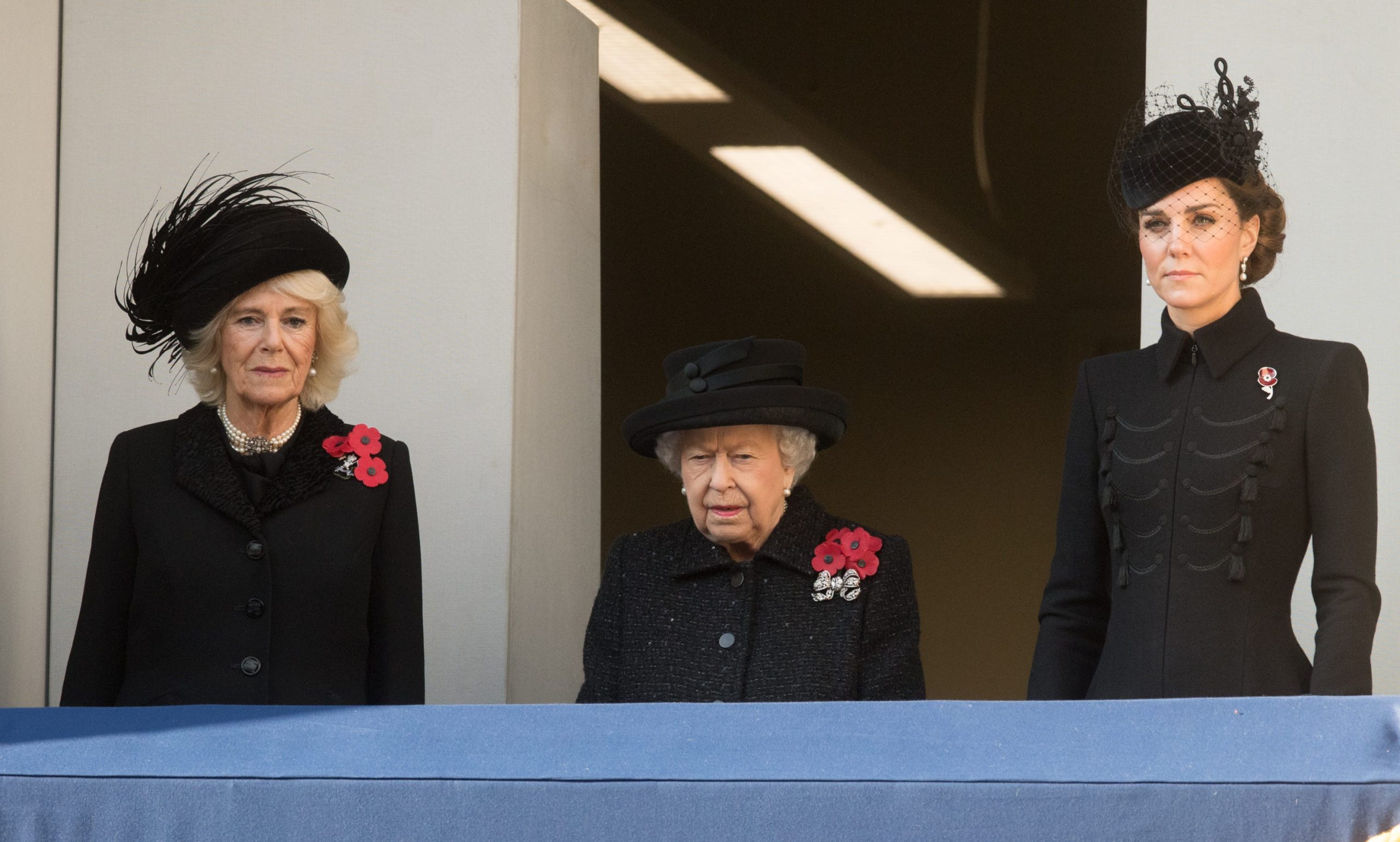 Queen Elizabeth II stands between the Duchess of Cornwall and the Duchess of Cambridge at the Remembrance Day service.