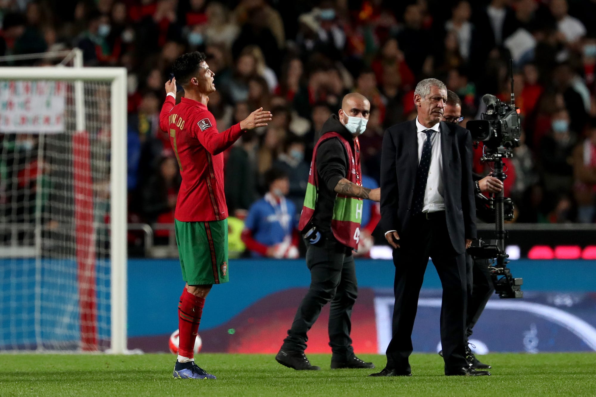 Portugal's forward Cristiano Ronaldo (L) reacts at the end of the FIFA World Cup Qatar 2022 qualification group A football match between Portugal and Serbia