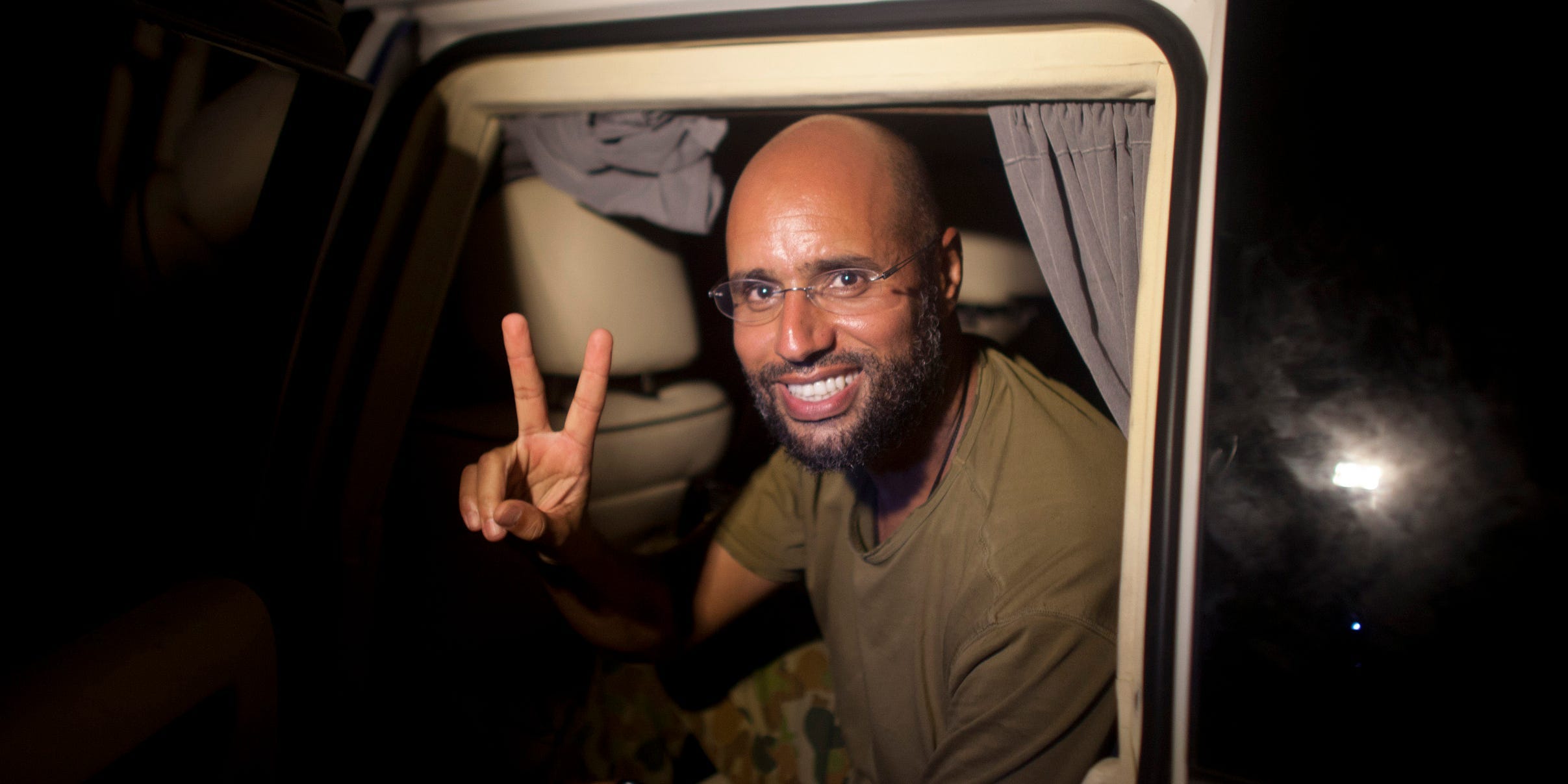 Saif al-Islam Kadhafi getting out a car