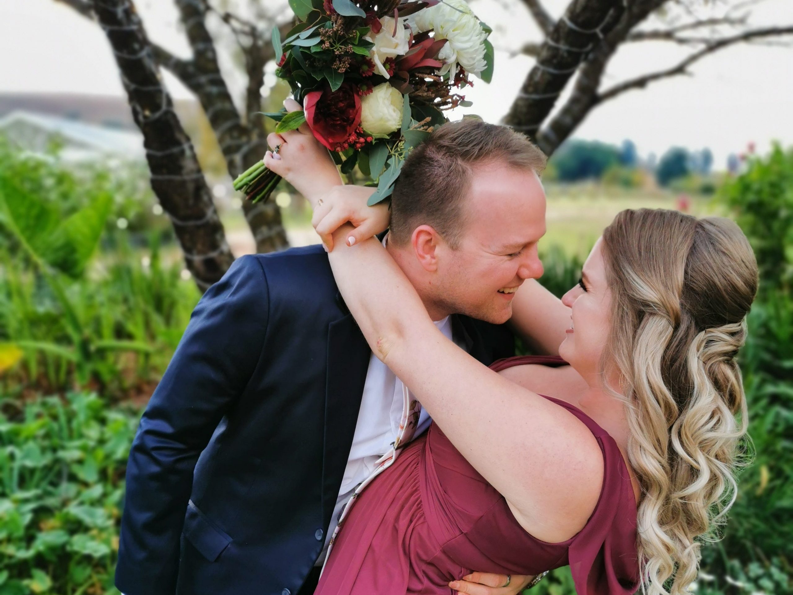 The couple posing for a photo