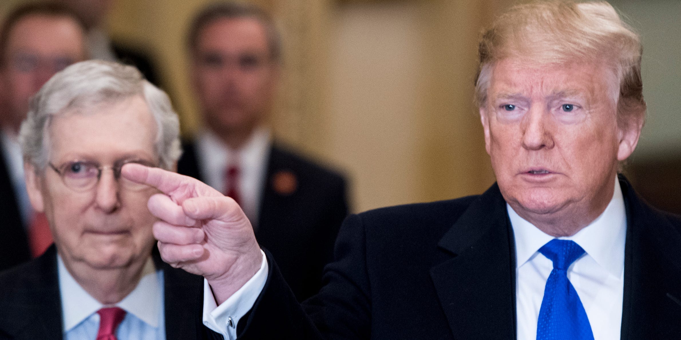 President Donald Trump takes questions from reporters he arrives with Senate Majority Leader Mitch McConnell, R-Ky., for the Senate Republicans' lunch in the Capitol on Tuesday, March 26, 2019.