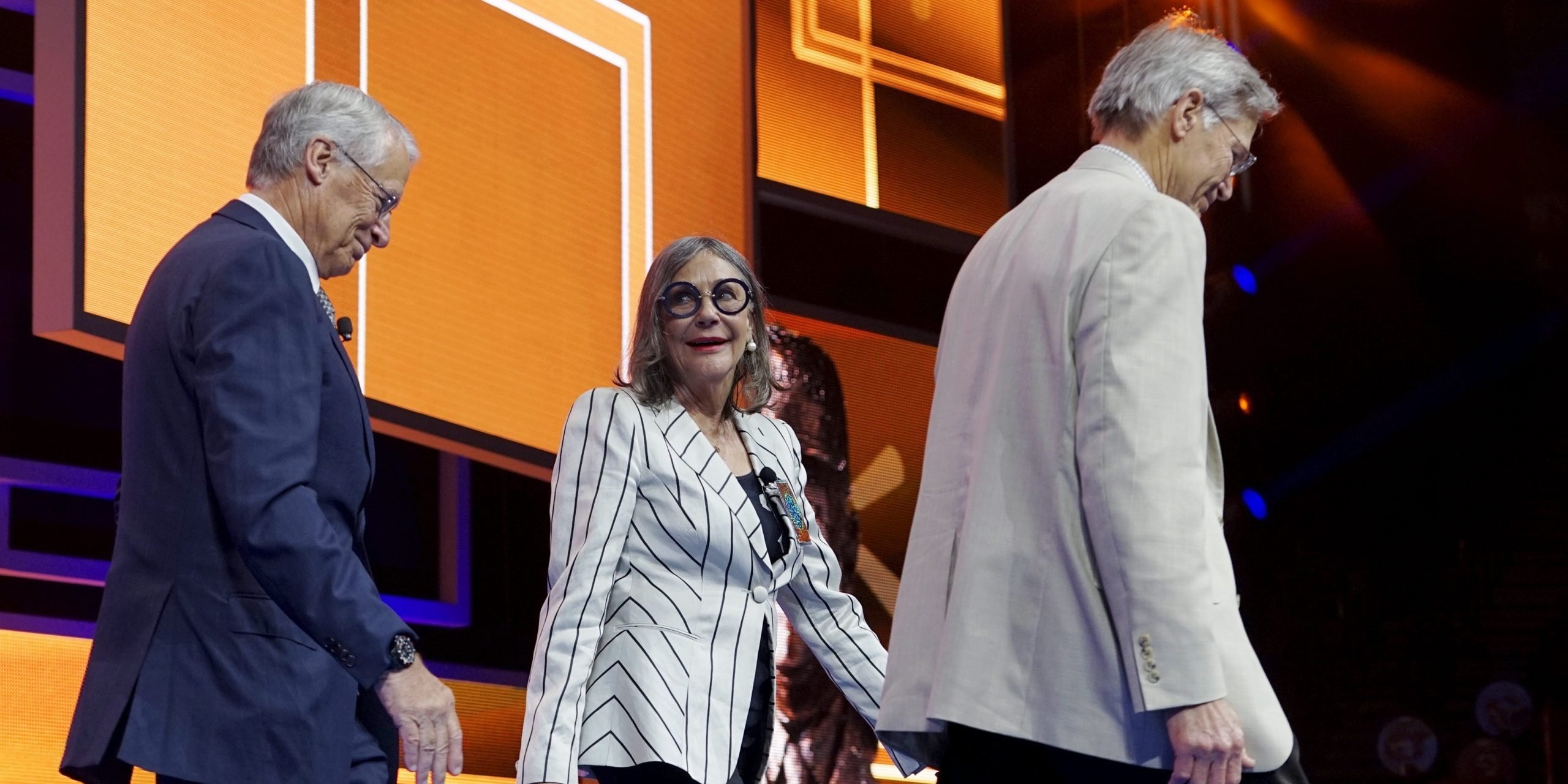 Walton family members (L to R) Rob, Alice and Jim Walton leave the stage after presenting an award at the Wal-Mart annual meeting in Fayetteville, Arkansas, June 5, 2015. Wal-Mart Stores Inc named Vice Chairman Greg Penner as its new chairman on Friday, replacing his father-in-law Rob Walton and cementing the founding family's influence over the board of the world's largest retailer.